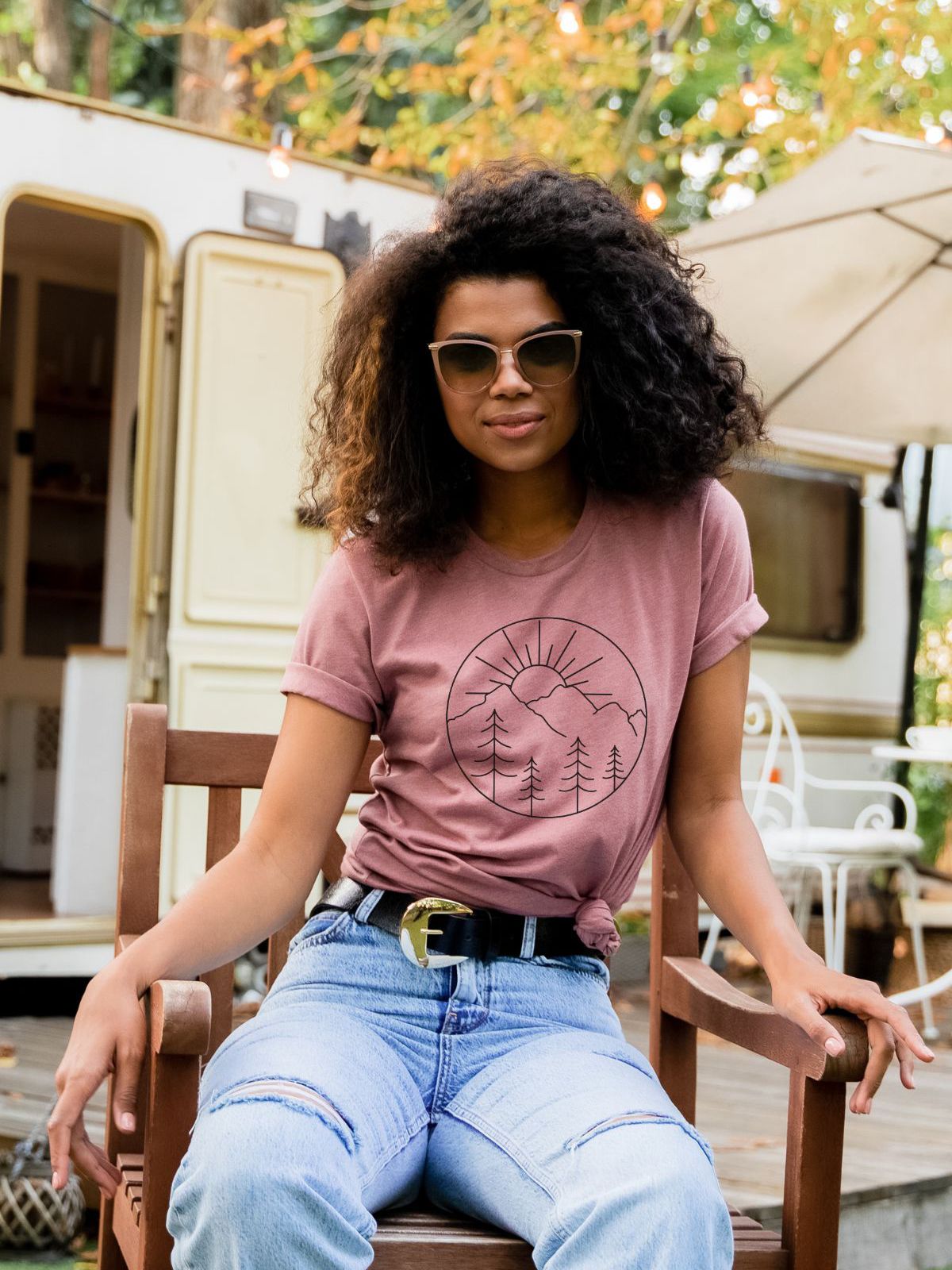 woman wearing a sunset mountains graphic t-shirt