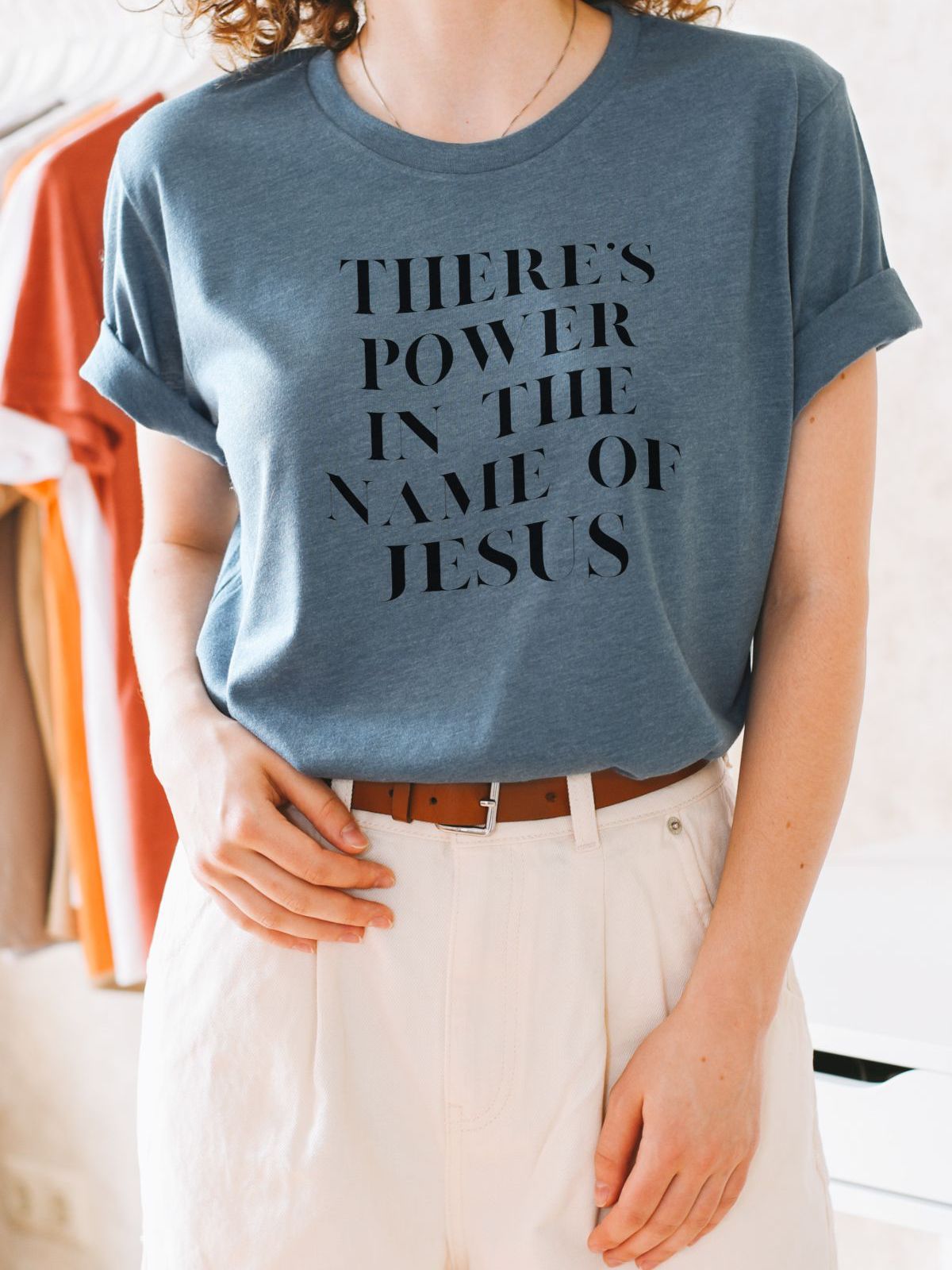 womens t-shirt with theres power in the name of jesus text