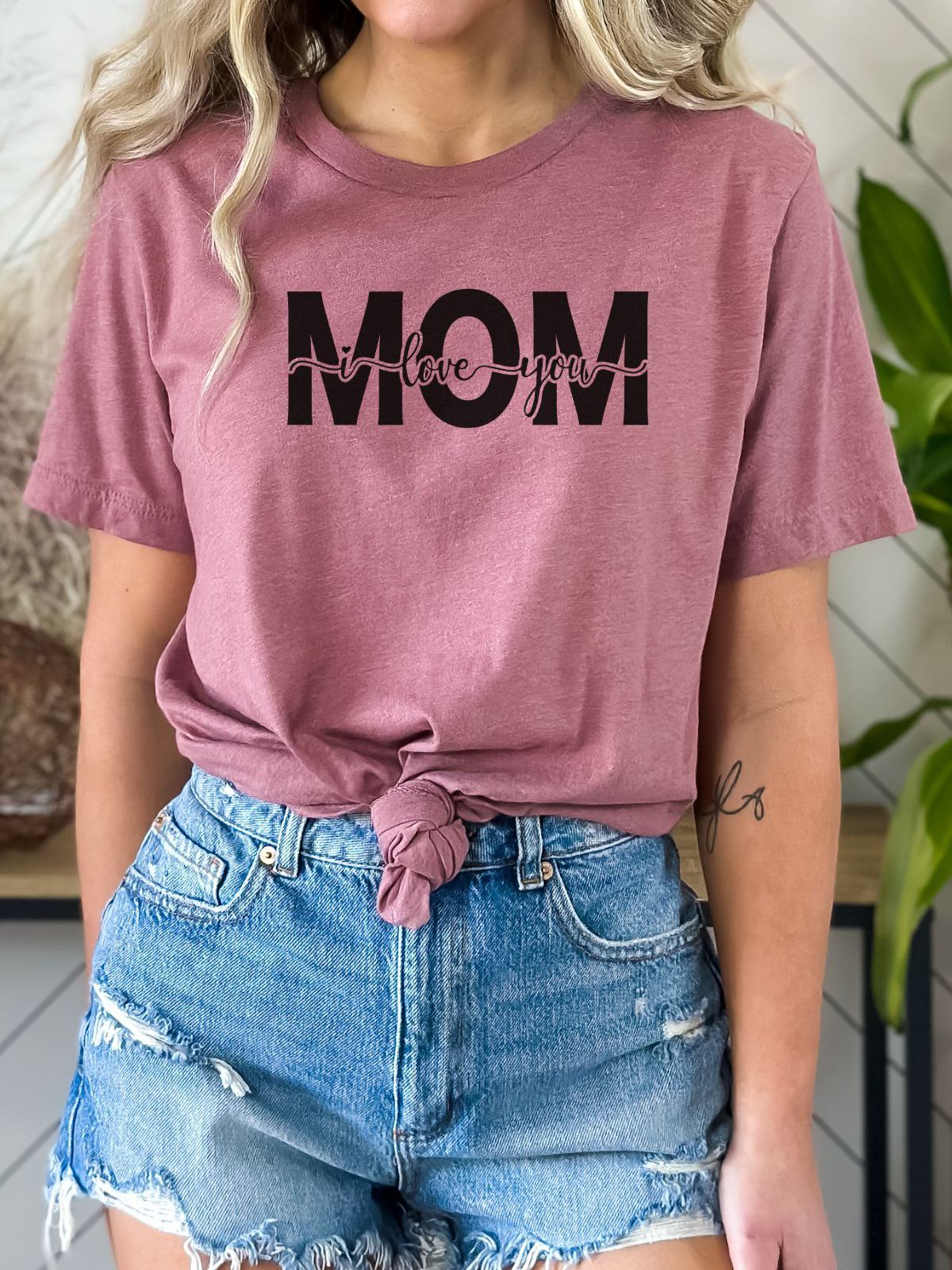 woman wearing pink t-shirt with I love you Mom design