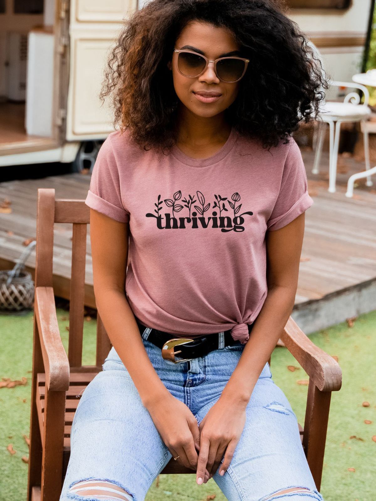 Woman wearing a pink t-shirt with thriving design