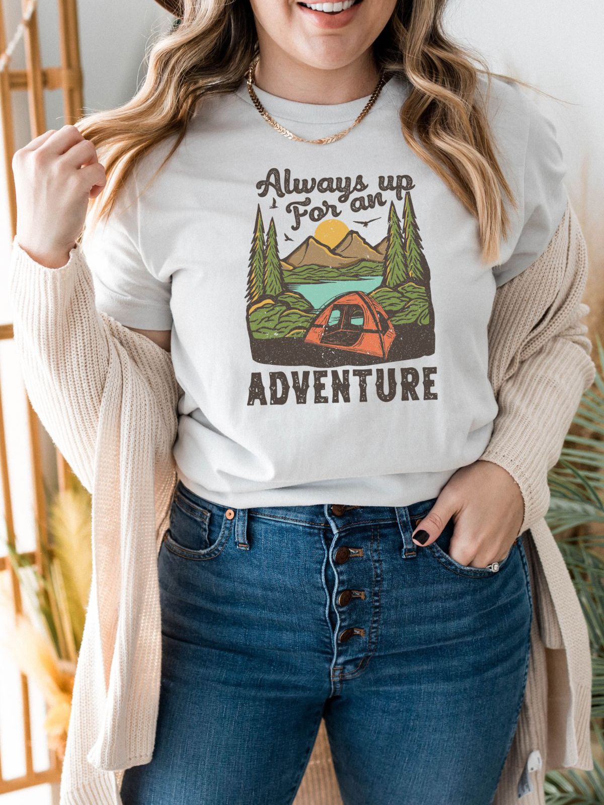 woman wearing adventure themed t-shirt with camping design