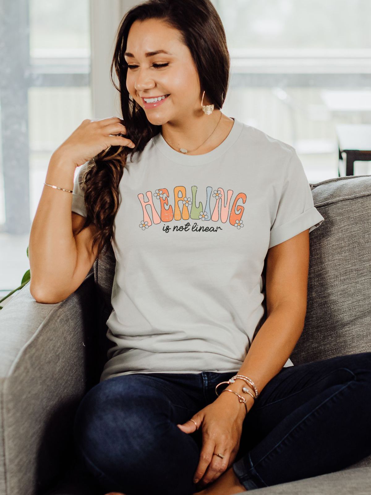 woman wearing healing is not linear t-shirt