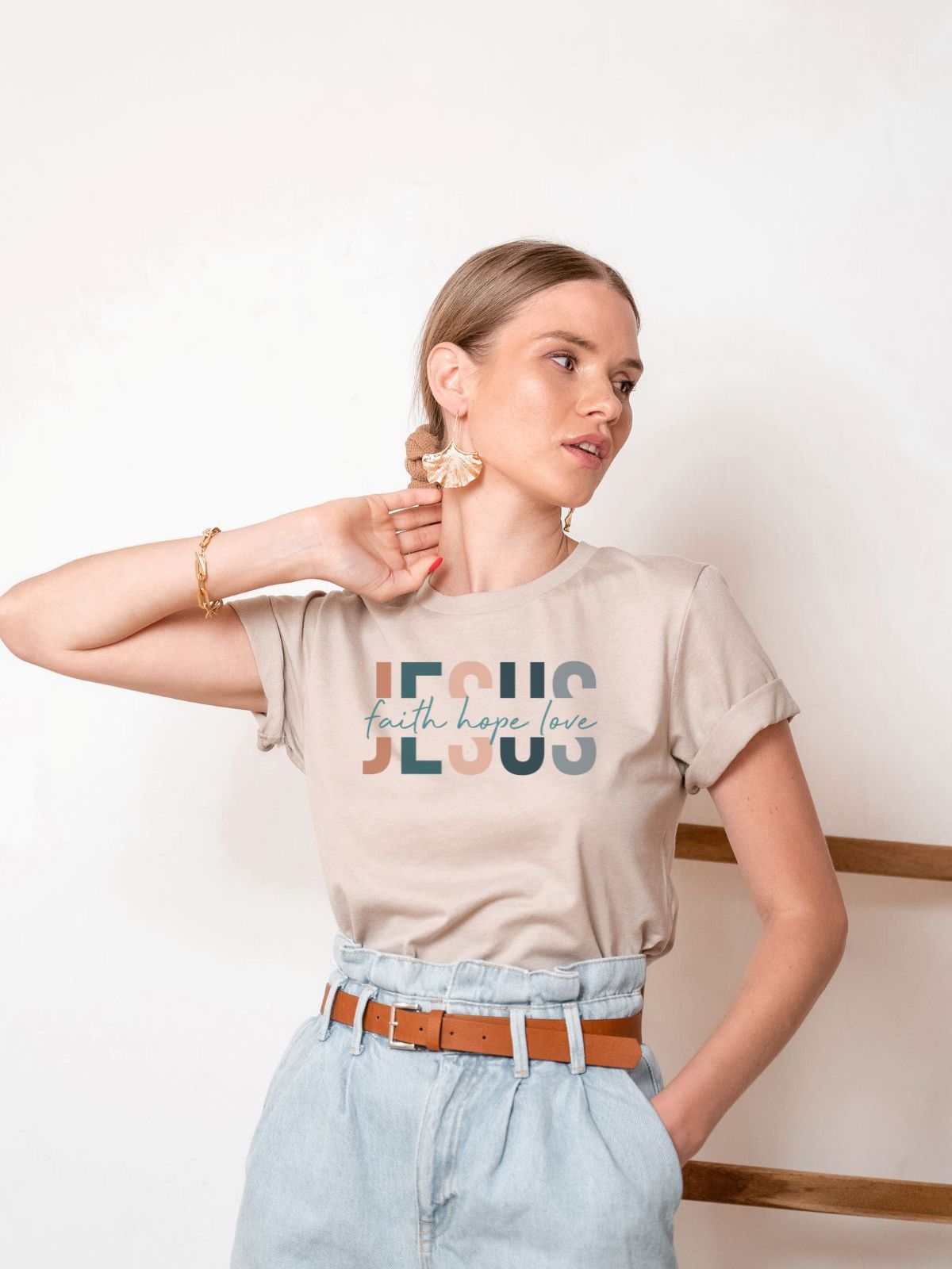 woman wearing Jesus faith hope love t-shirt