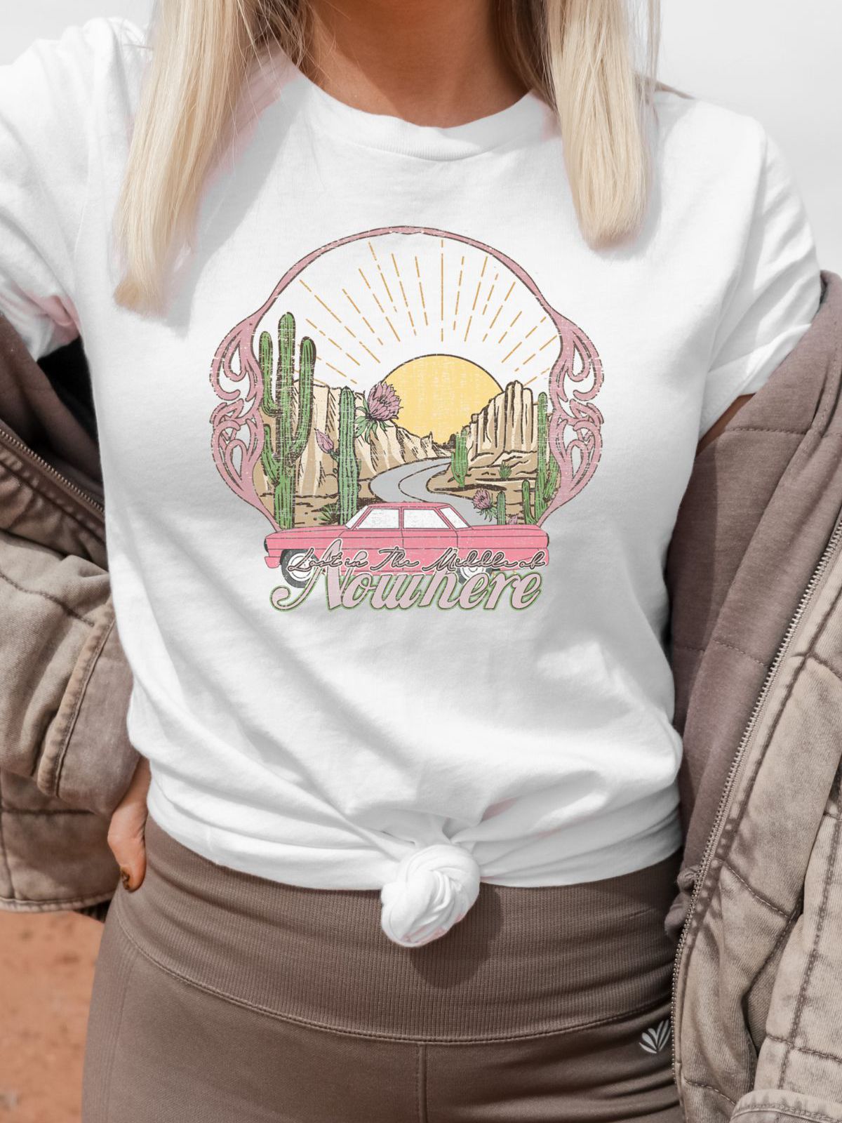 Woman wearing white t-shirt with desert road design