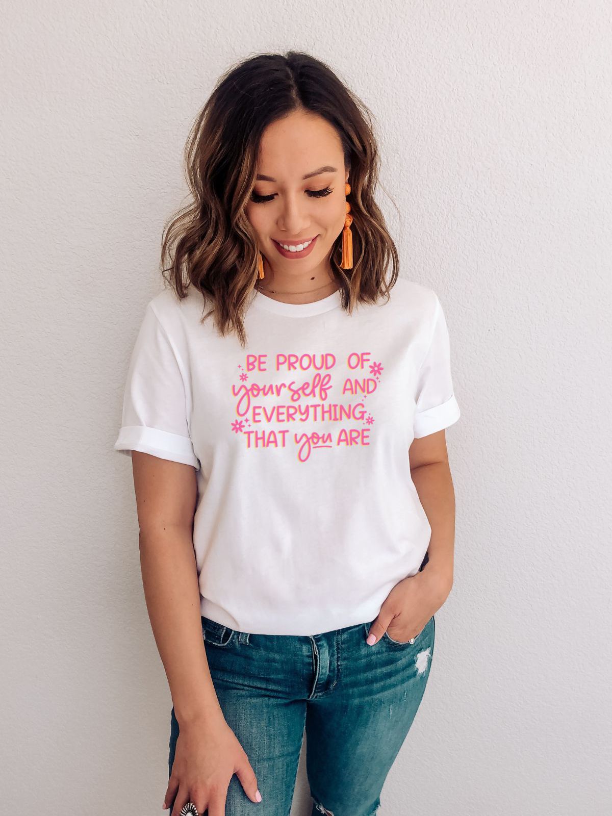 white t-shirt with Be Proud of Yourself text