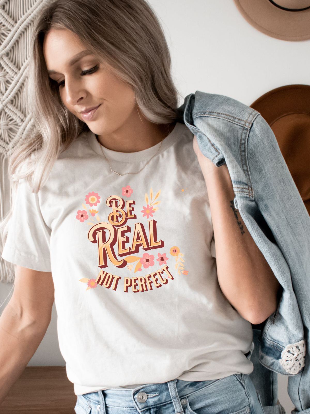woman wearing t-shirt with Be Real Not Perfect design