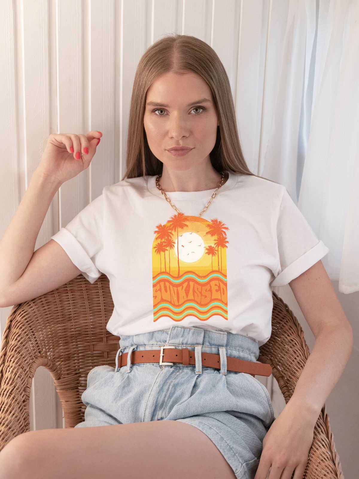 woman wearing sunkissed themed t-shirt with palm trees