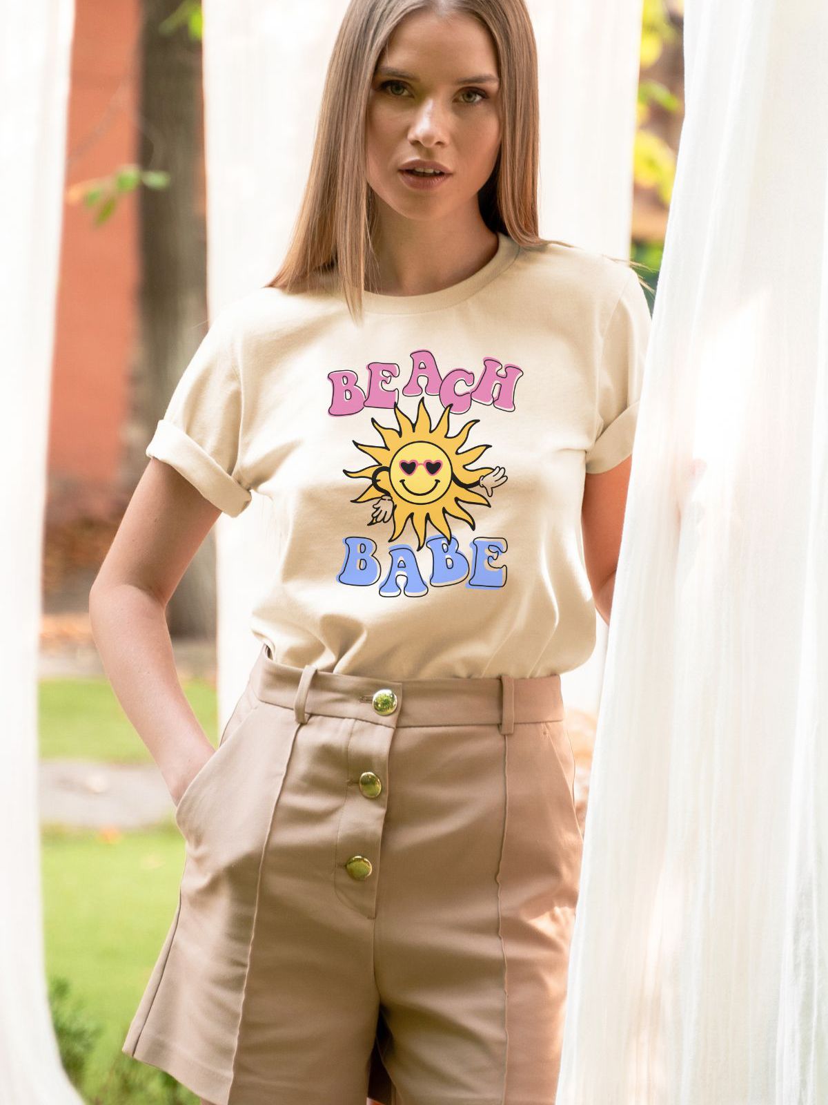 woman wearing Beach Babe t-shirt with sun design