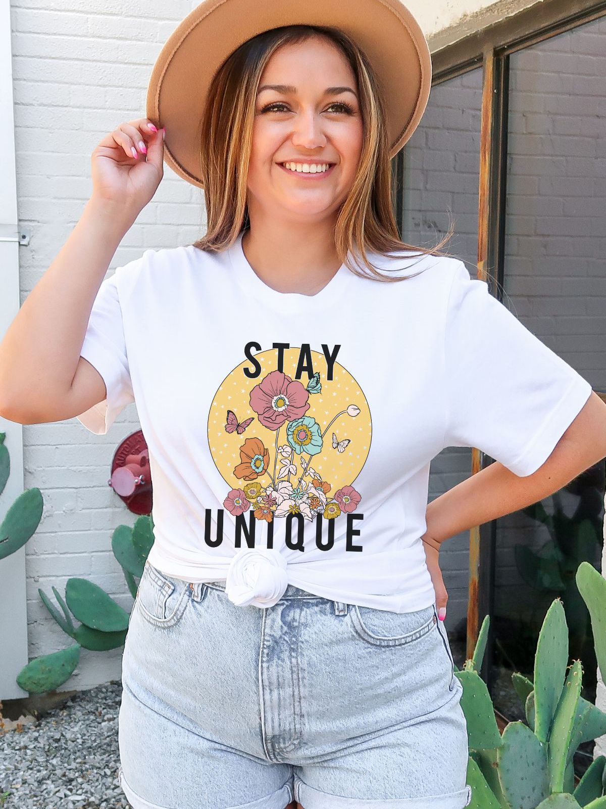 woman wearing Stay Unique floral t-shirt