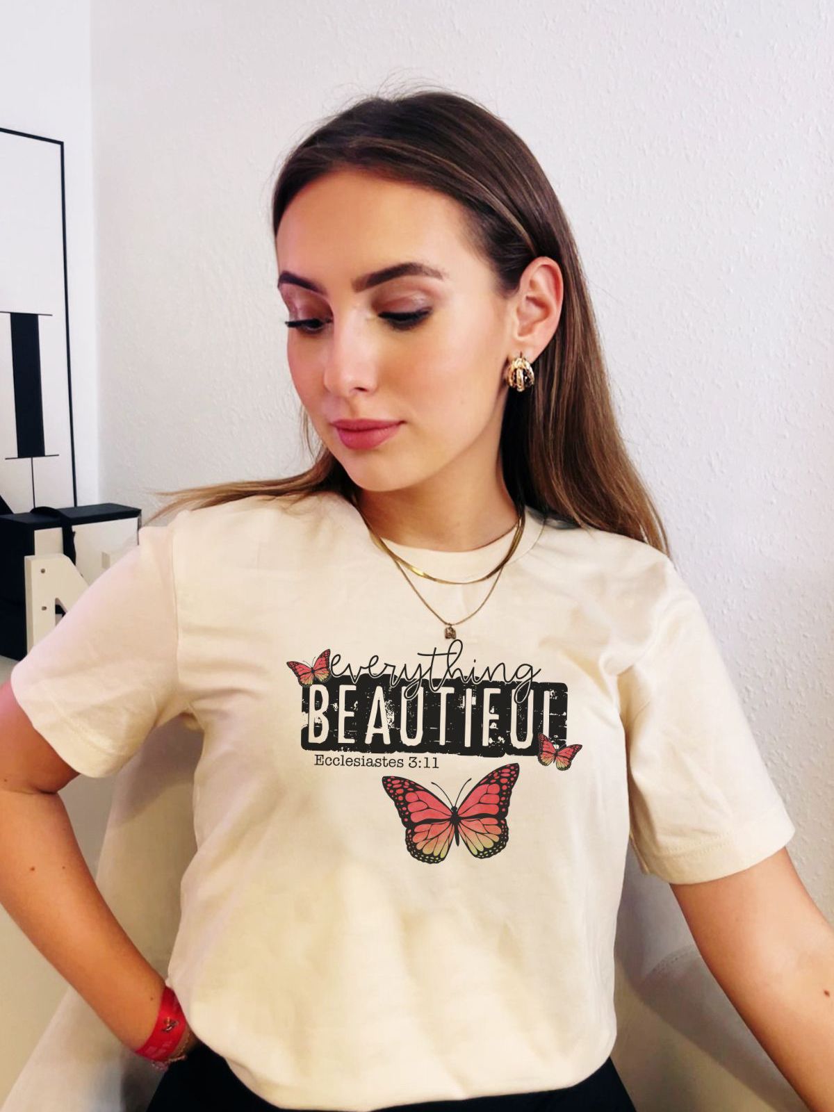 woman wearing Everything Beautiful butterfly tshirt