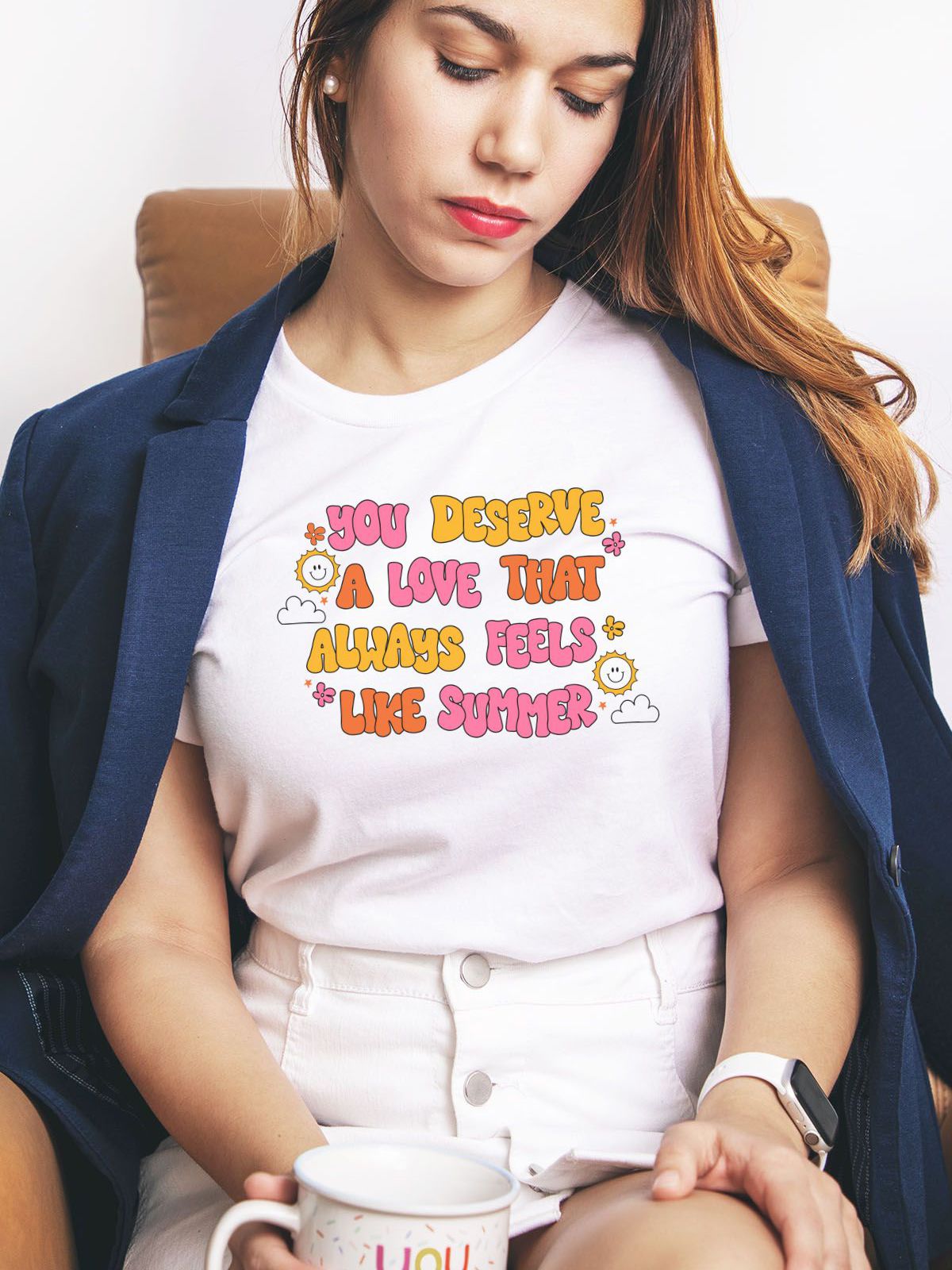 woman wearing a white t-shirt with text You Deserve A Love That Always Feels Like Summer