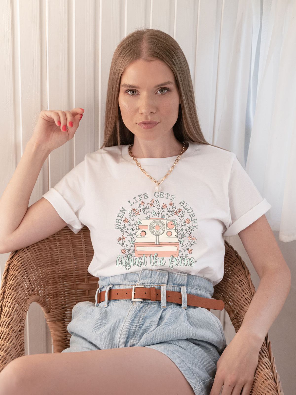 woman wearing a vintage camera t-shirt