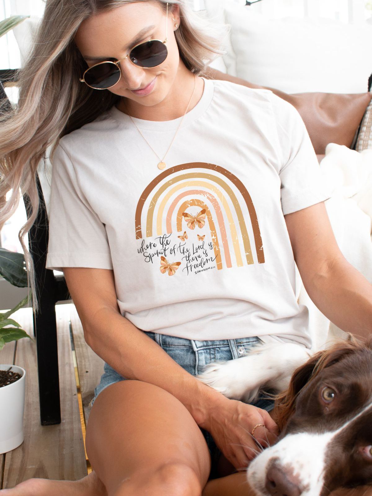 woman wearing rainbow quote tshirt with dog
