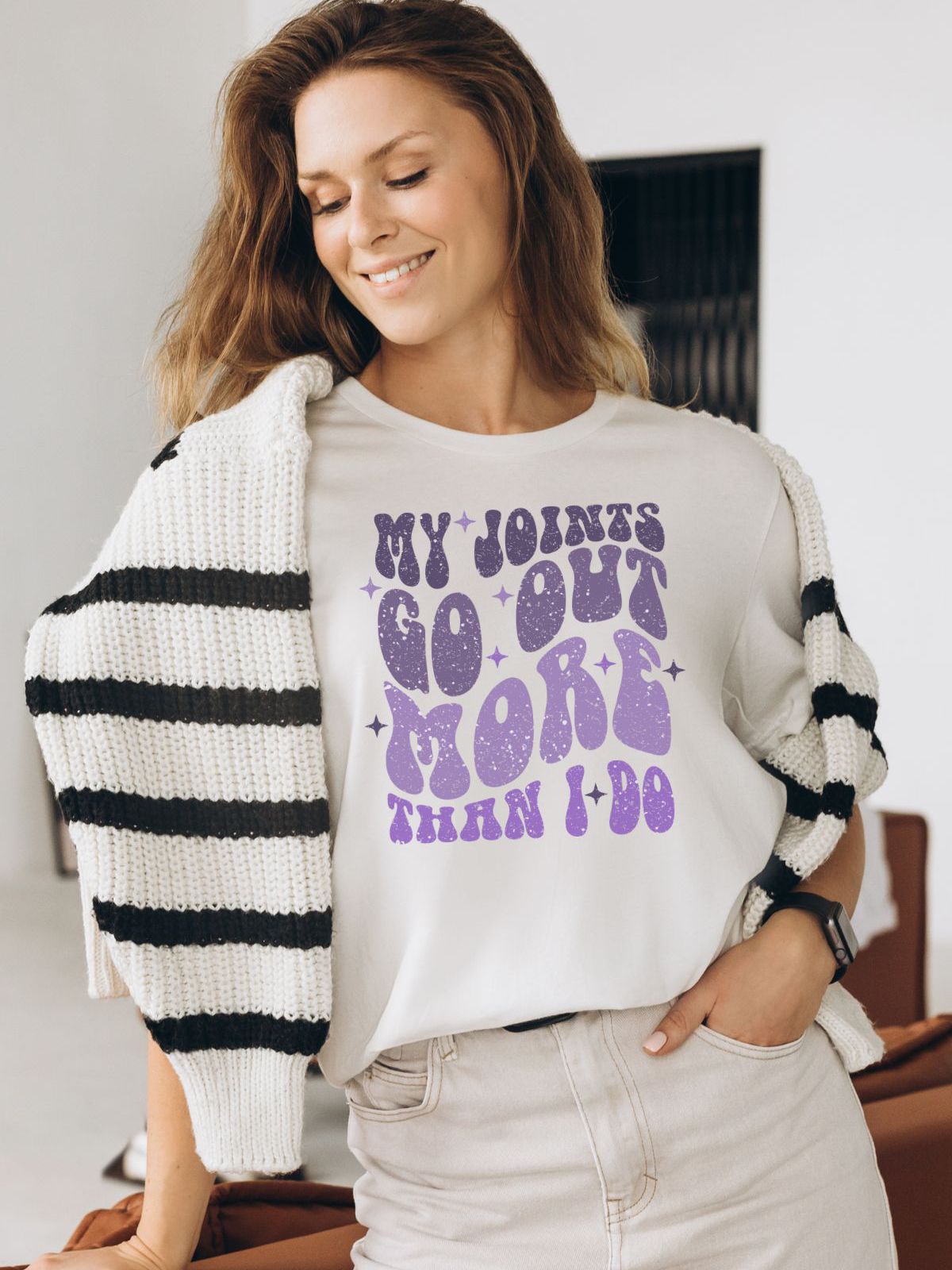 woman wearing t-shirt with my joints go out more than i do graphic