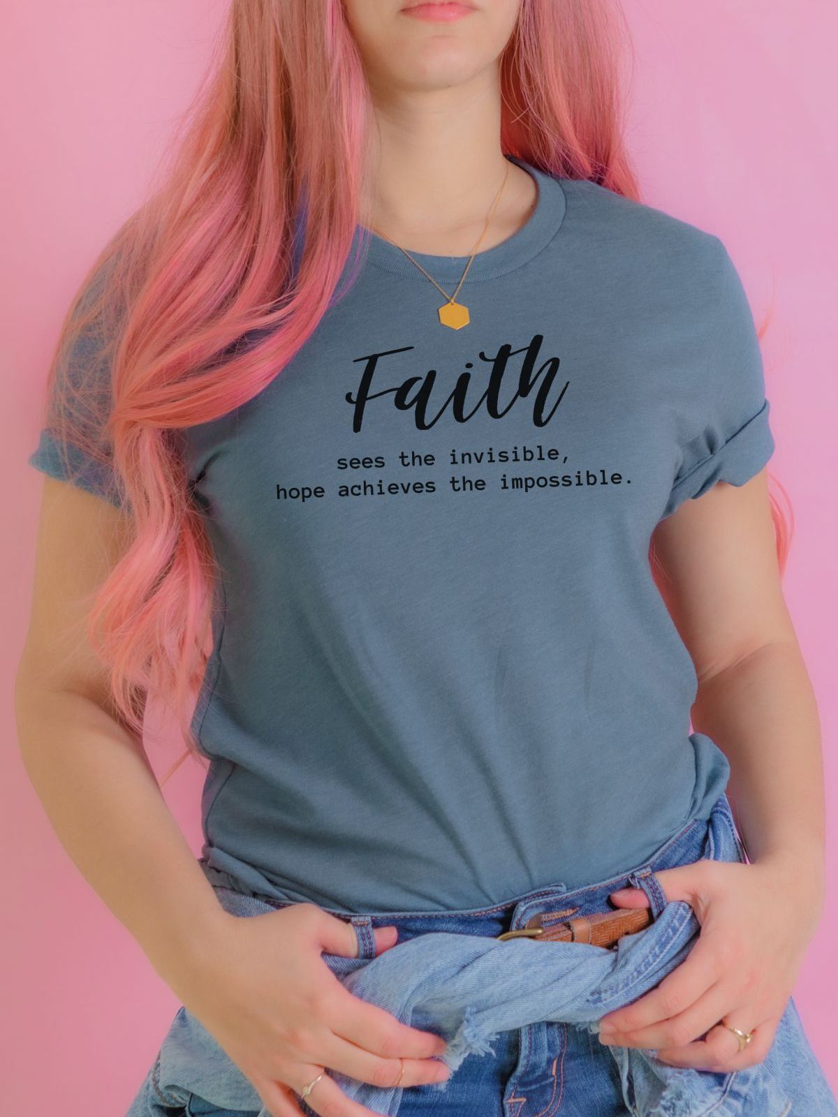 woman wearing a blue t-shirt with faith inspirational quote