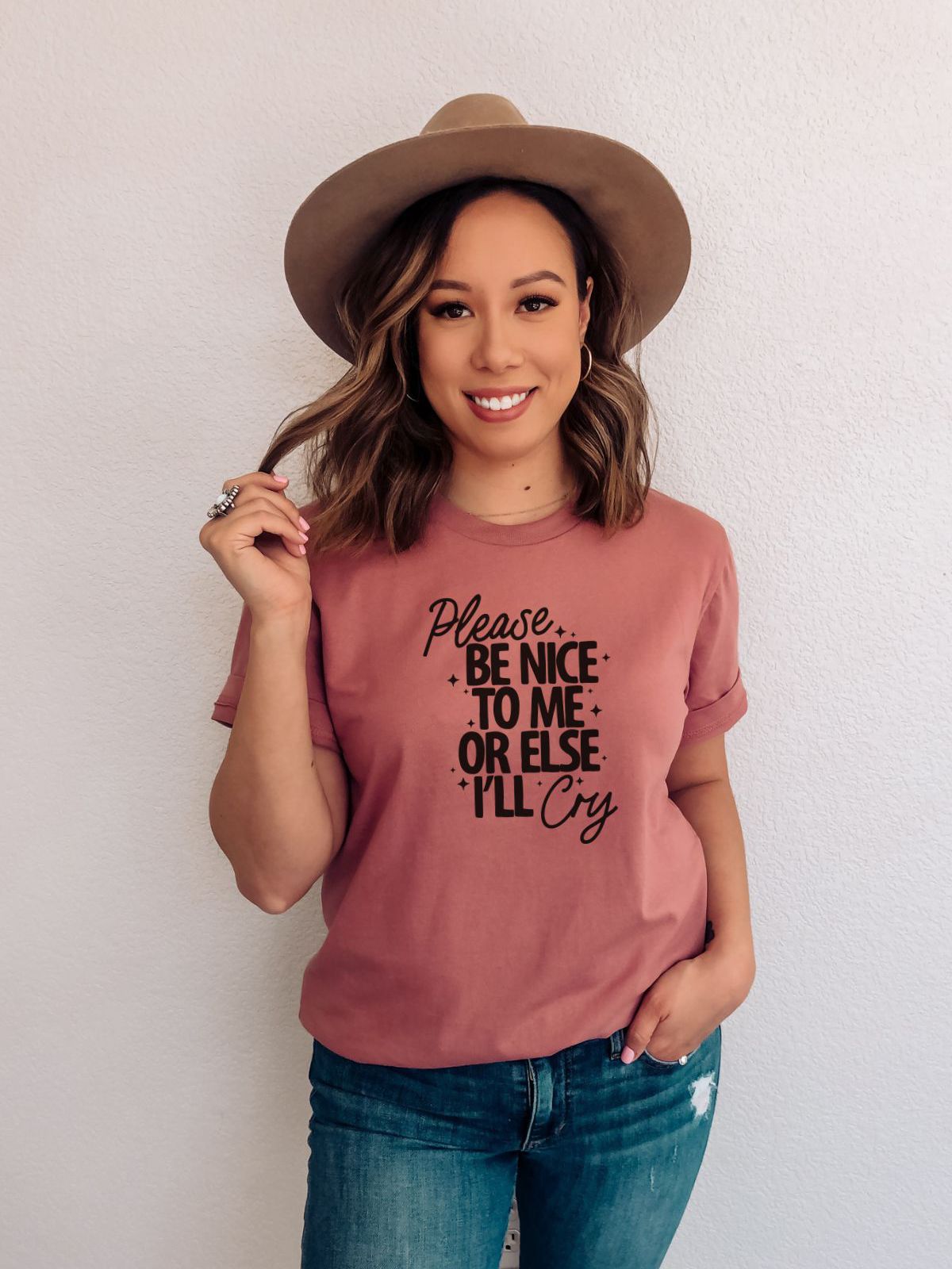 woman wearing a t-shirt with text please be nice to me or else I will cry