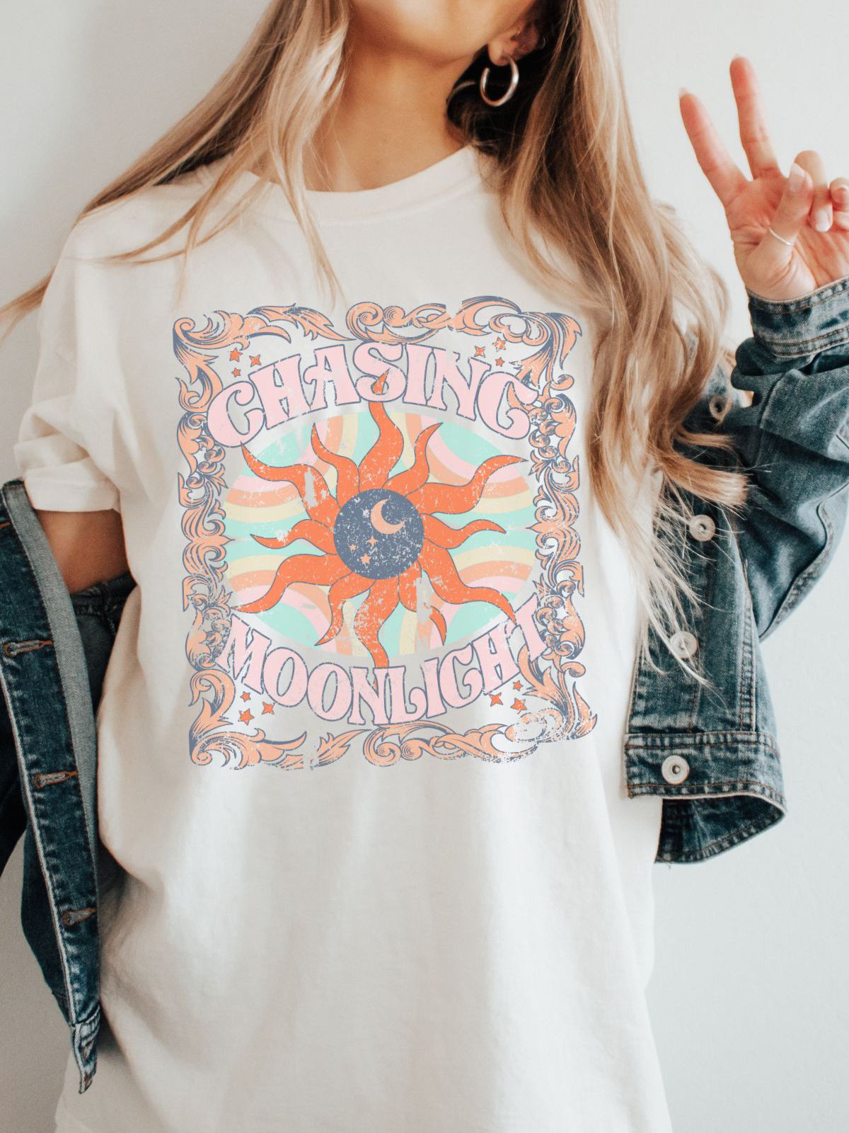 A woman wearing a Chasing Moonlight graphic t-shirt