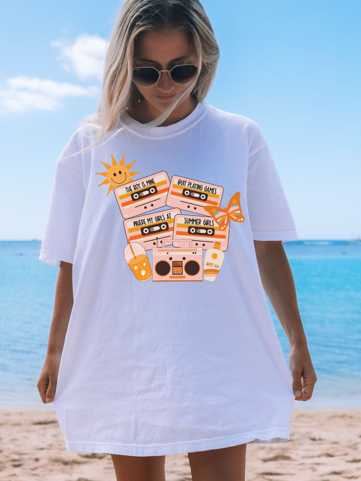woman wearing summer cassette t-shirt on beach