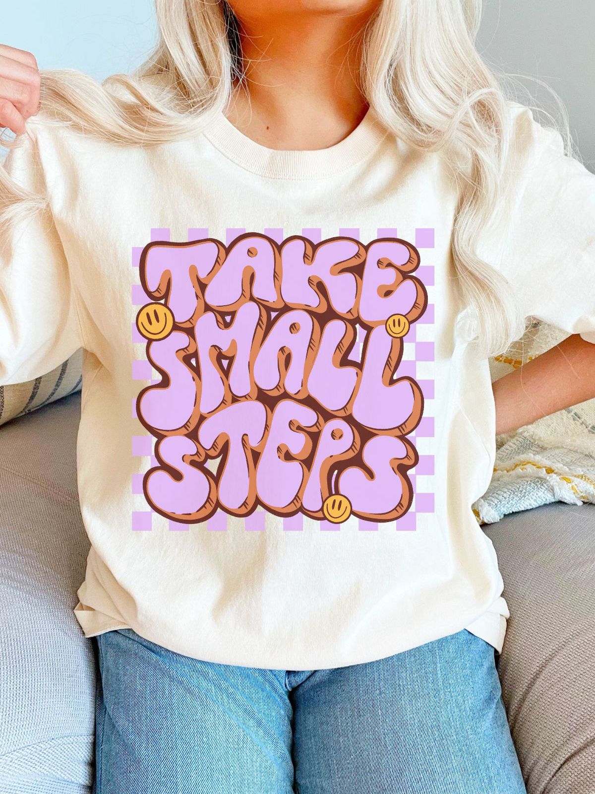 woman wearing take small steps t-shirt