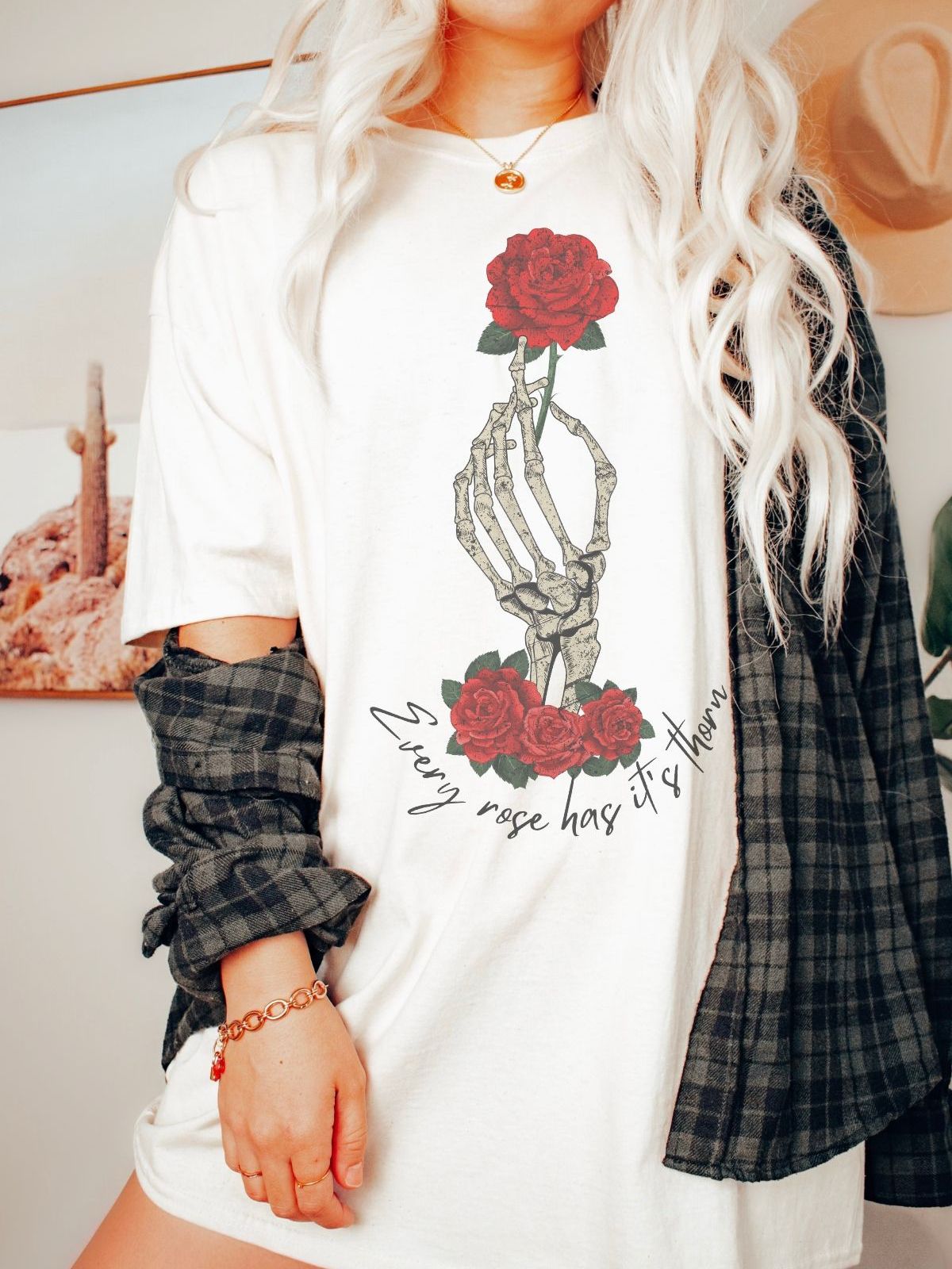 skeleton hand holding a red rose graphic tee