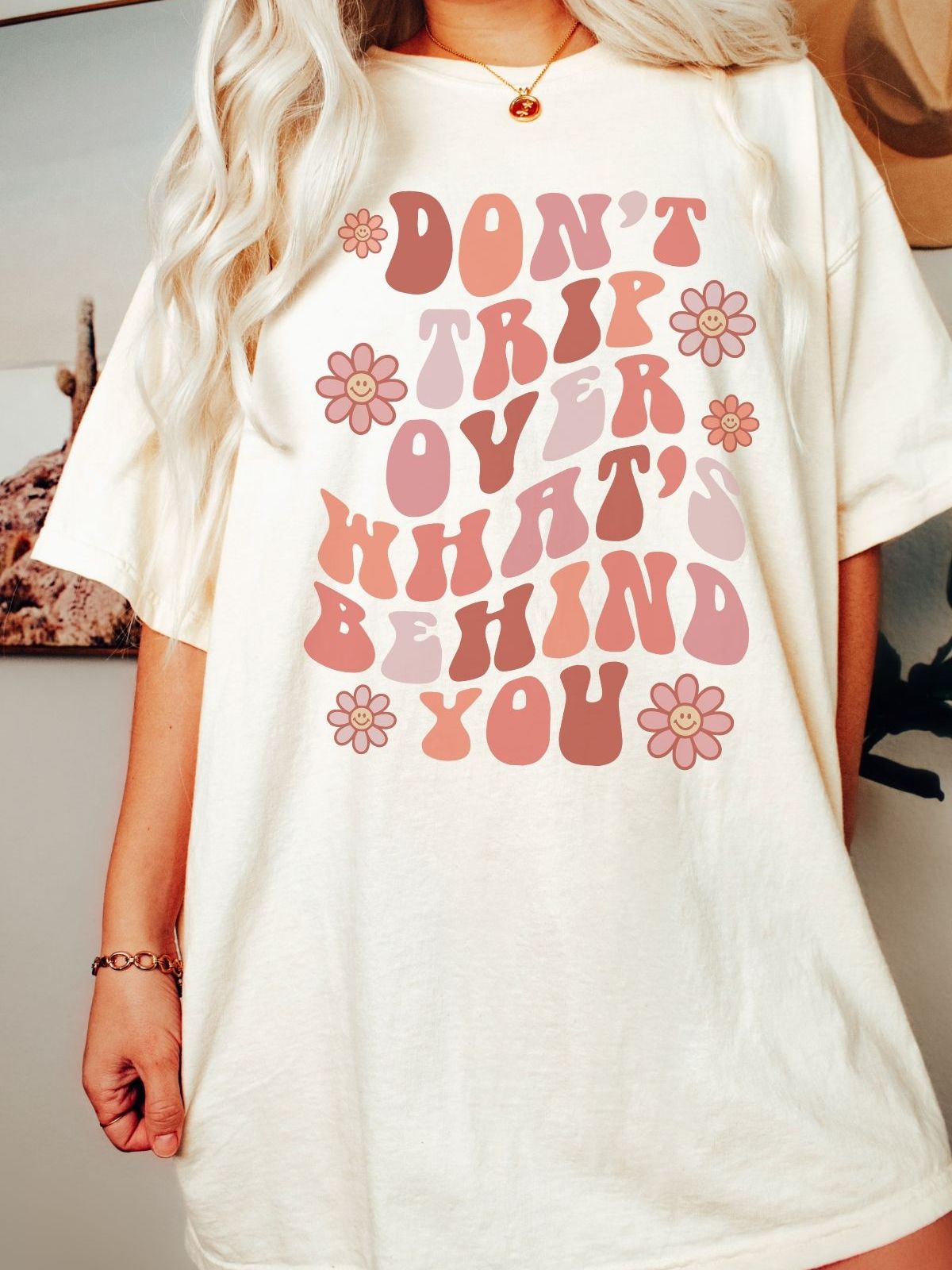 womens t-shirt with dont trip over whats behind you text