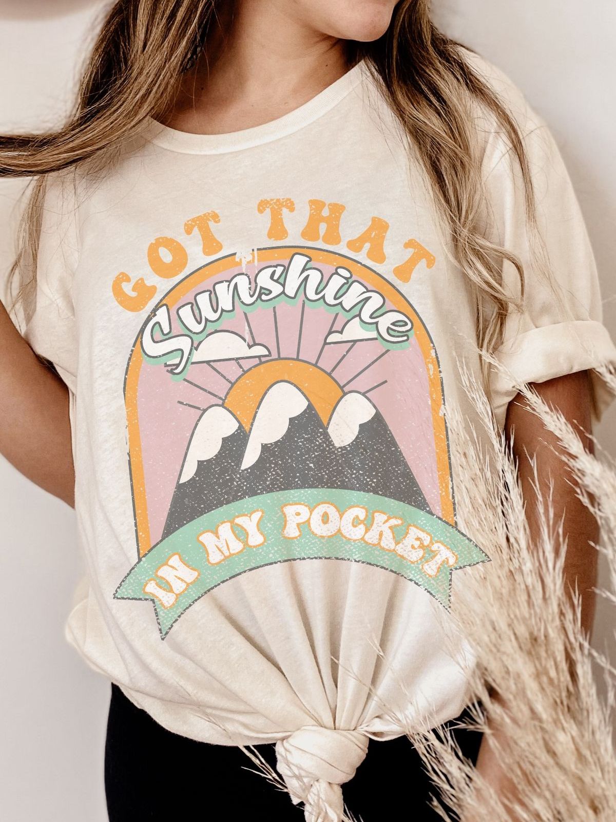 woman wearing sunshine graphic t-shirt
