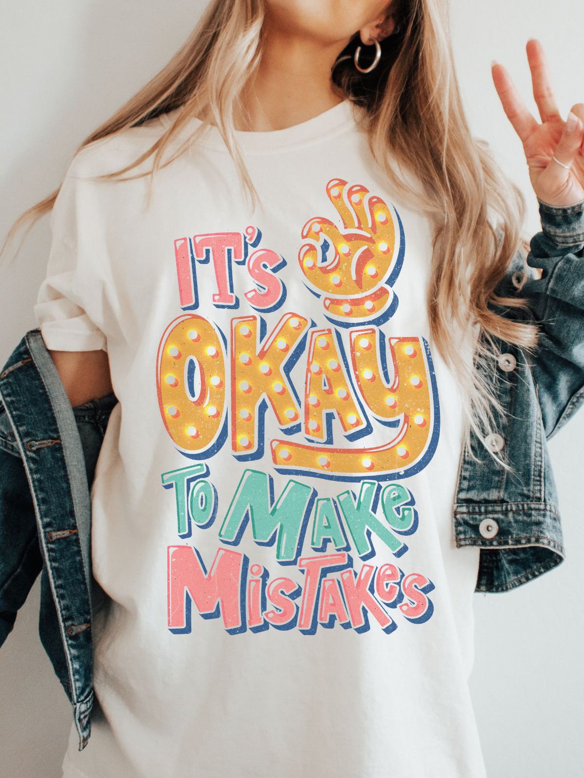 person wearing It's Okay to Make Mistakes t-shirt