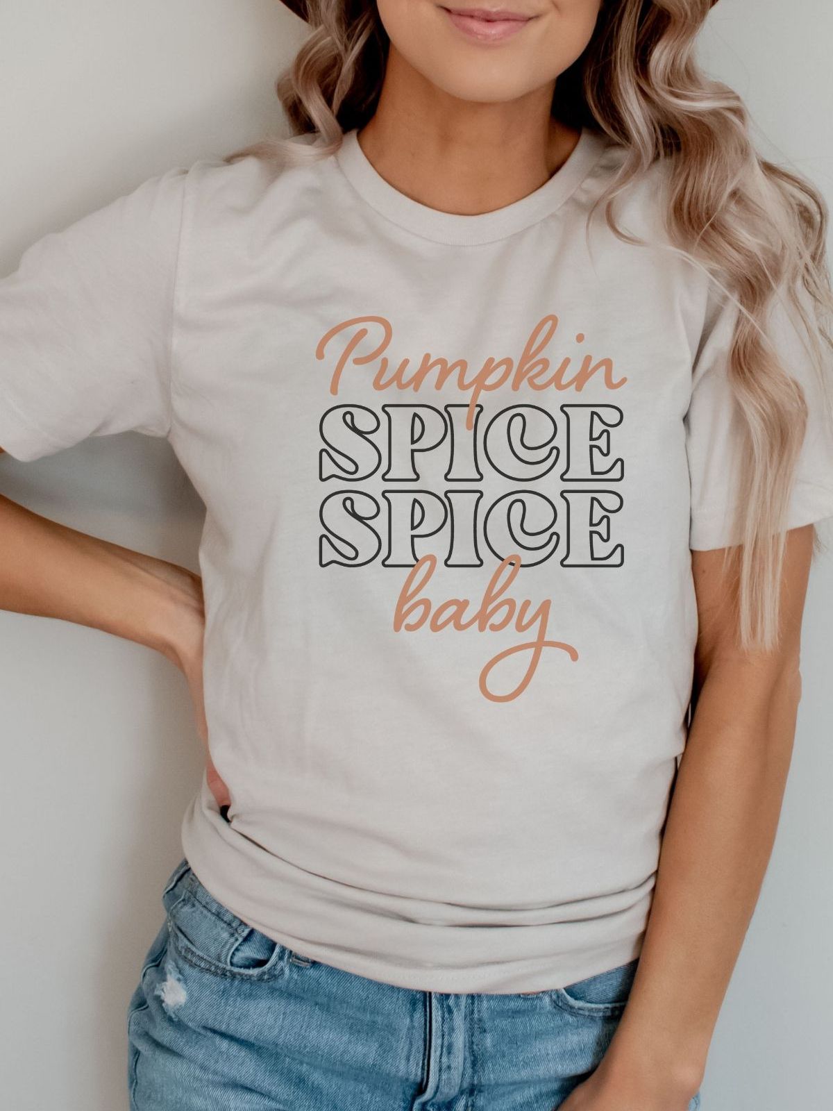woman wearing pumpkin spice baby shirt
