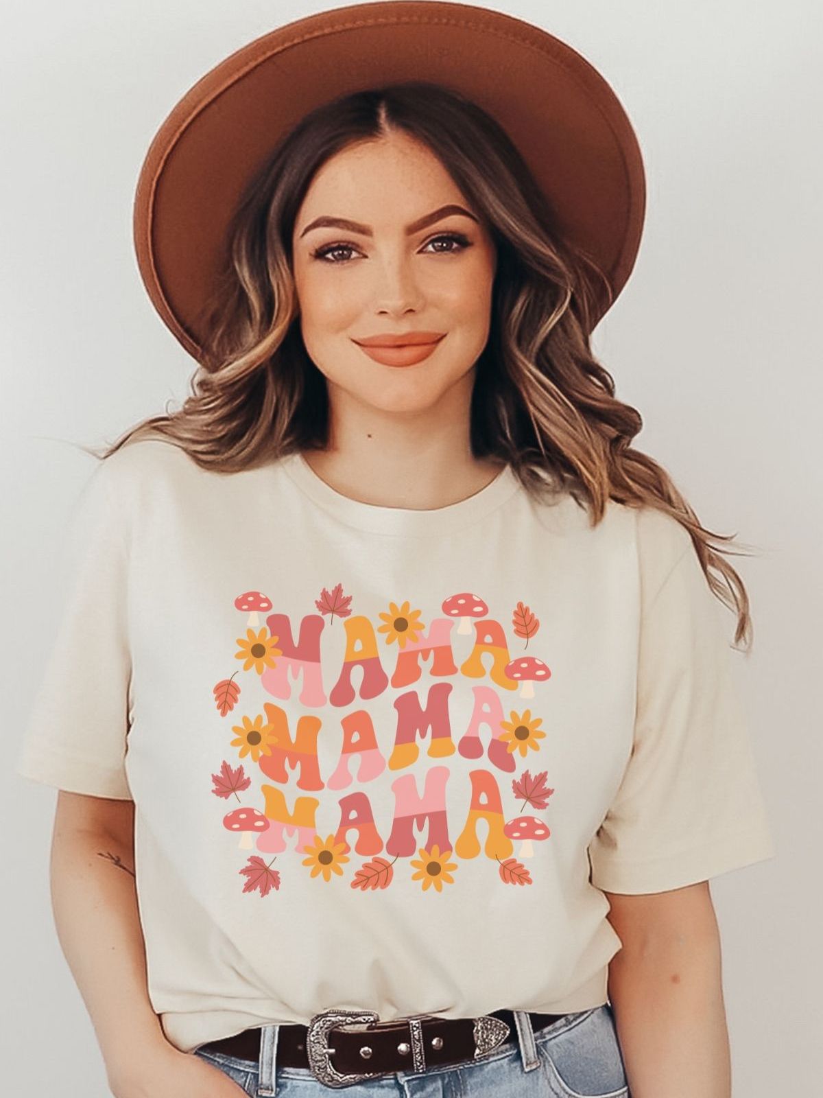 woman wearing mama graphic tee with flowers and leaves