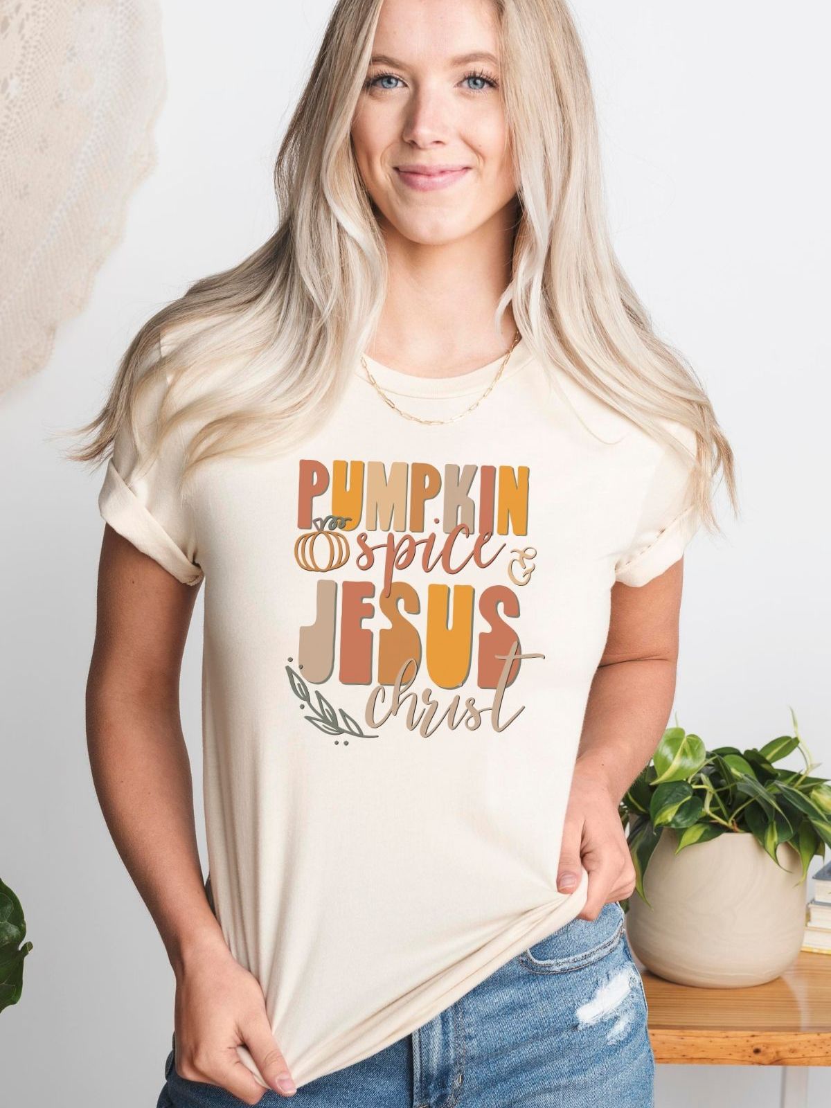 woman wearing pumpkin spice jesus christ t-shirt