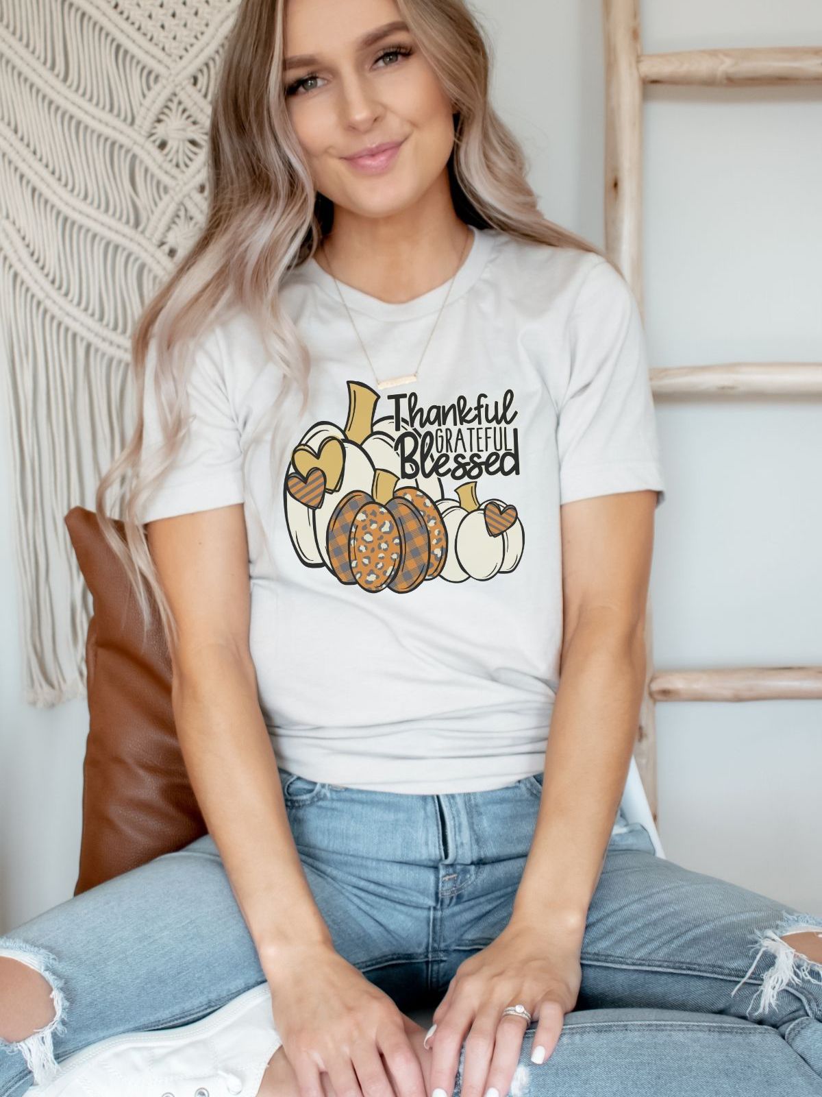 woman wearing thankful grateful blessed pumpkin themed t-shirt