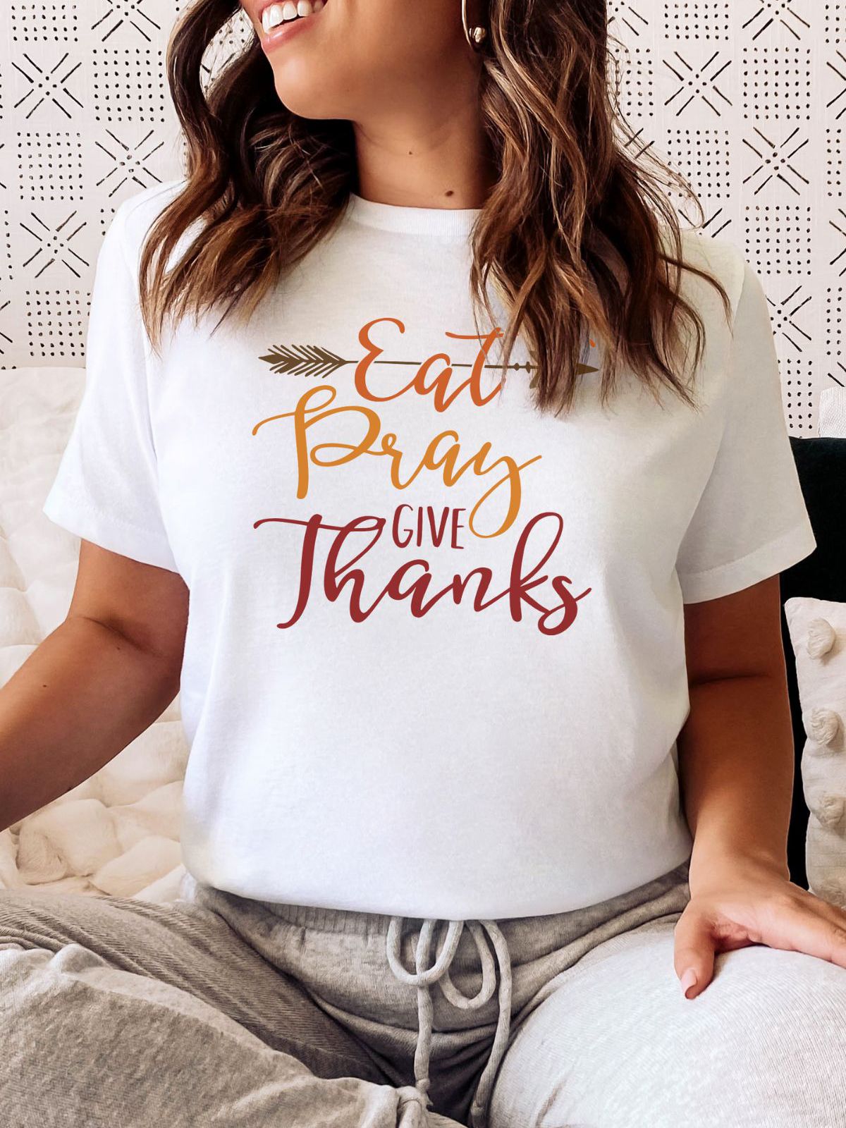 woman wearing Eat Pray Give Thanks tee