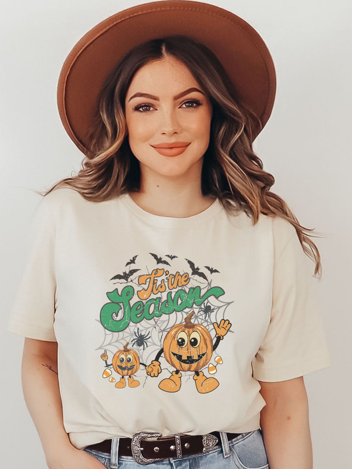 woman wearing tis the season halloween t-shirt with pumpkins and bats