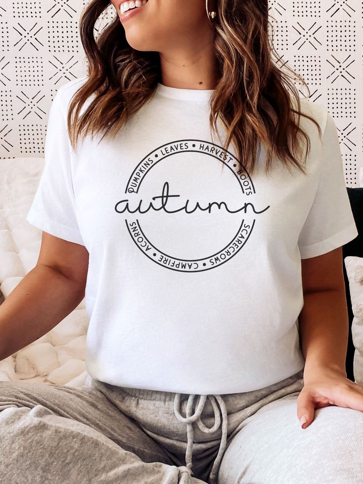 White t-shirt with autumn text and circular design