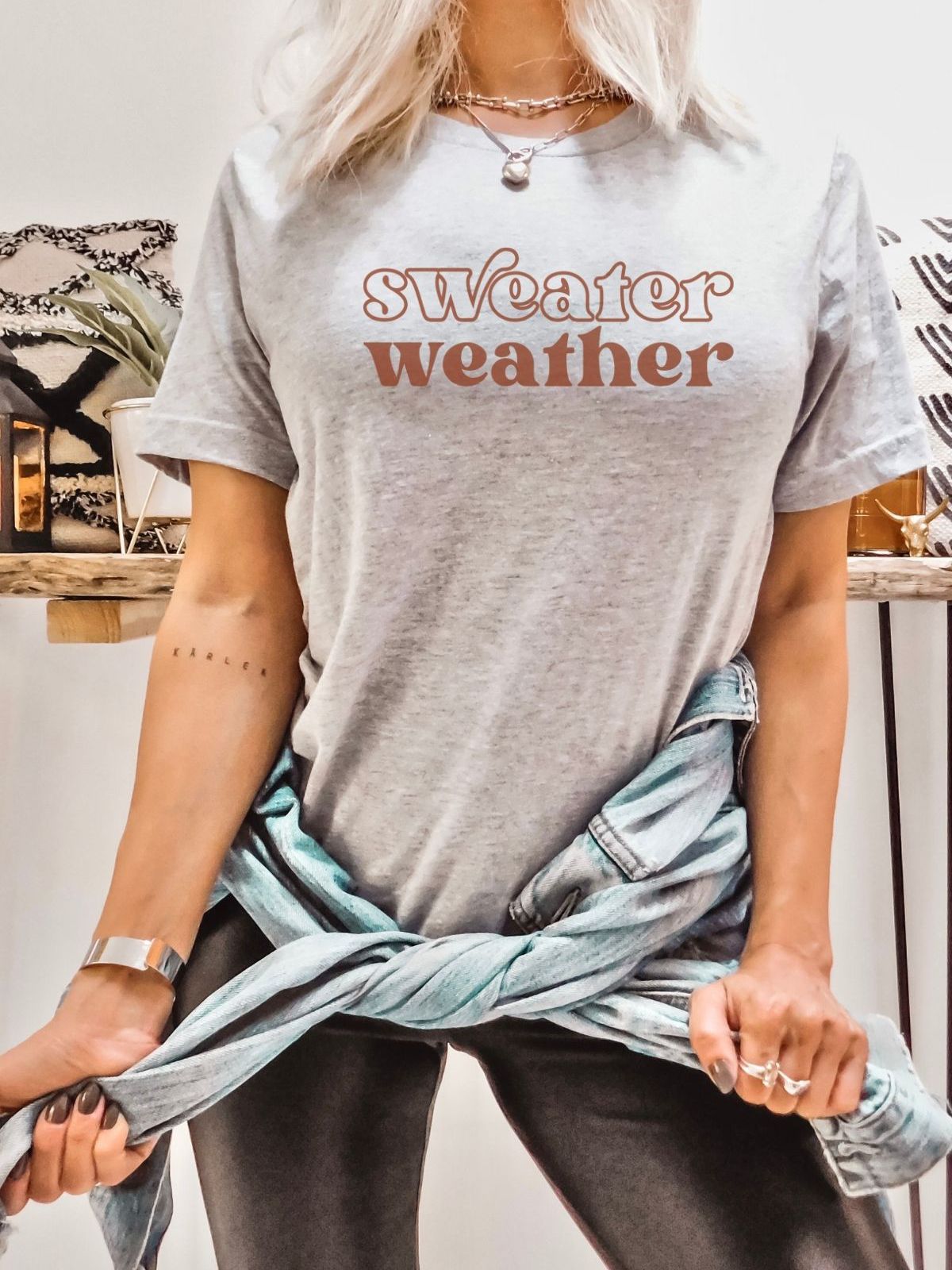 woman wearing sweater weather t-shirt