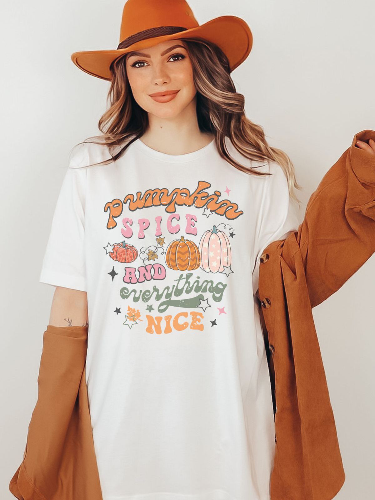 woman wearing pumpkin spice themed t-shirt for fall