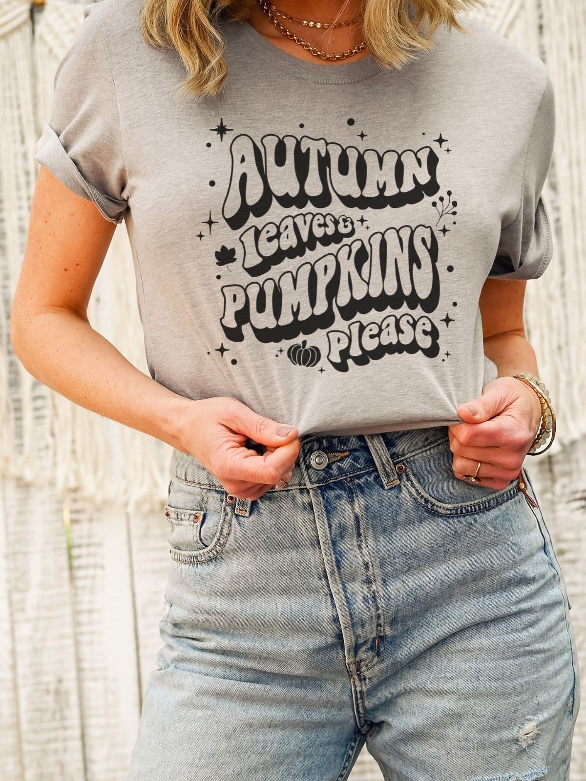Woman wearing gray tee with Autumn Leaves Pumpkins print
