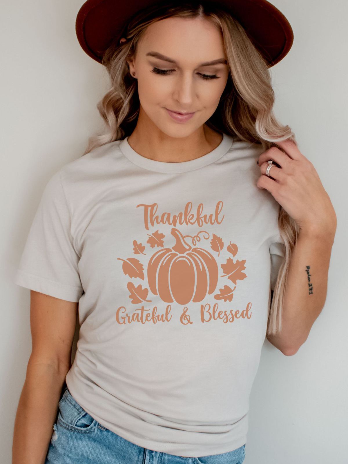 woman wearing thankful grateful blessed t-shirt with pumpkin design