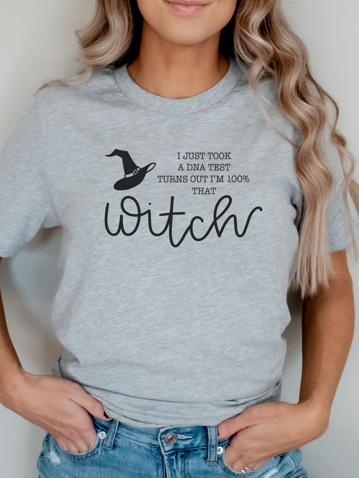 woman wearing witch themed halloween t-shirt