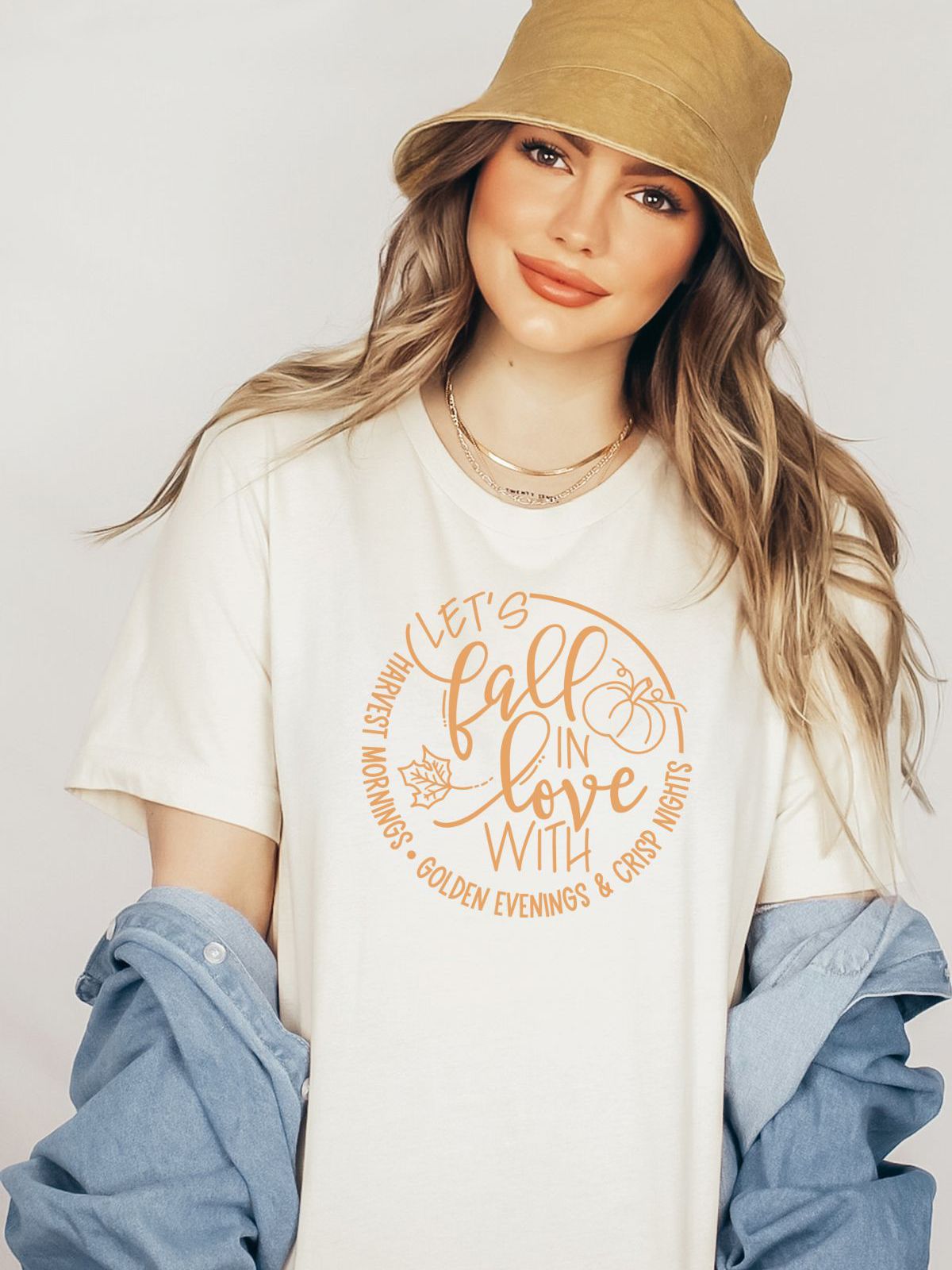 woman wearing fall themed t-shirt with autumn graphic