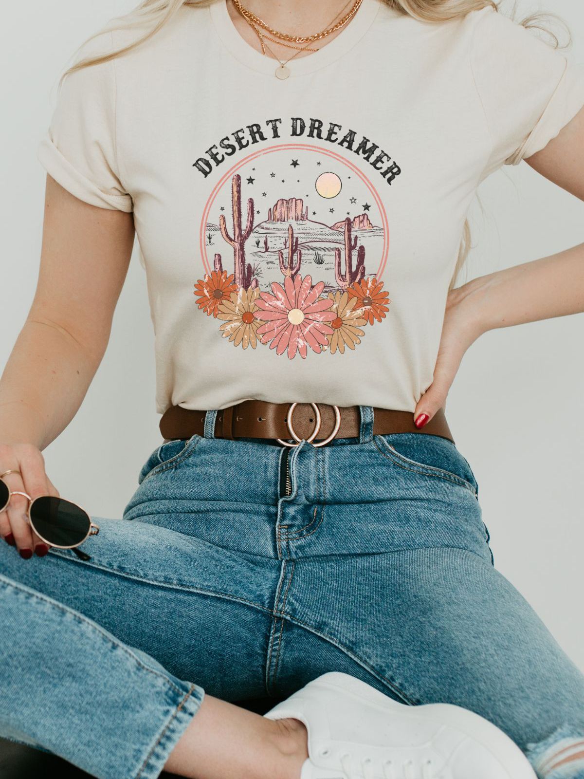 Woman wearing Desert Dreamer T-shirt with cactus design
