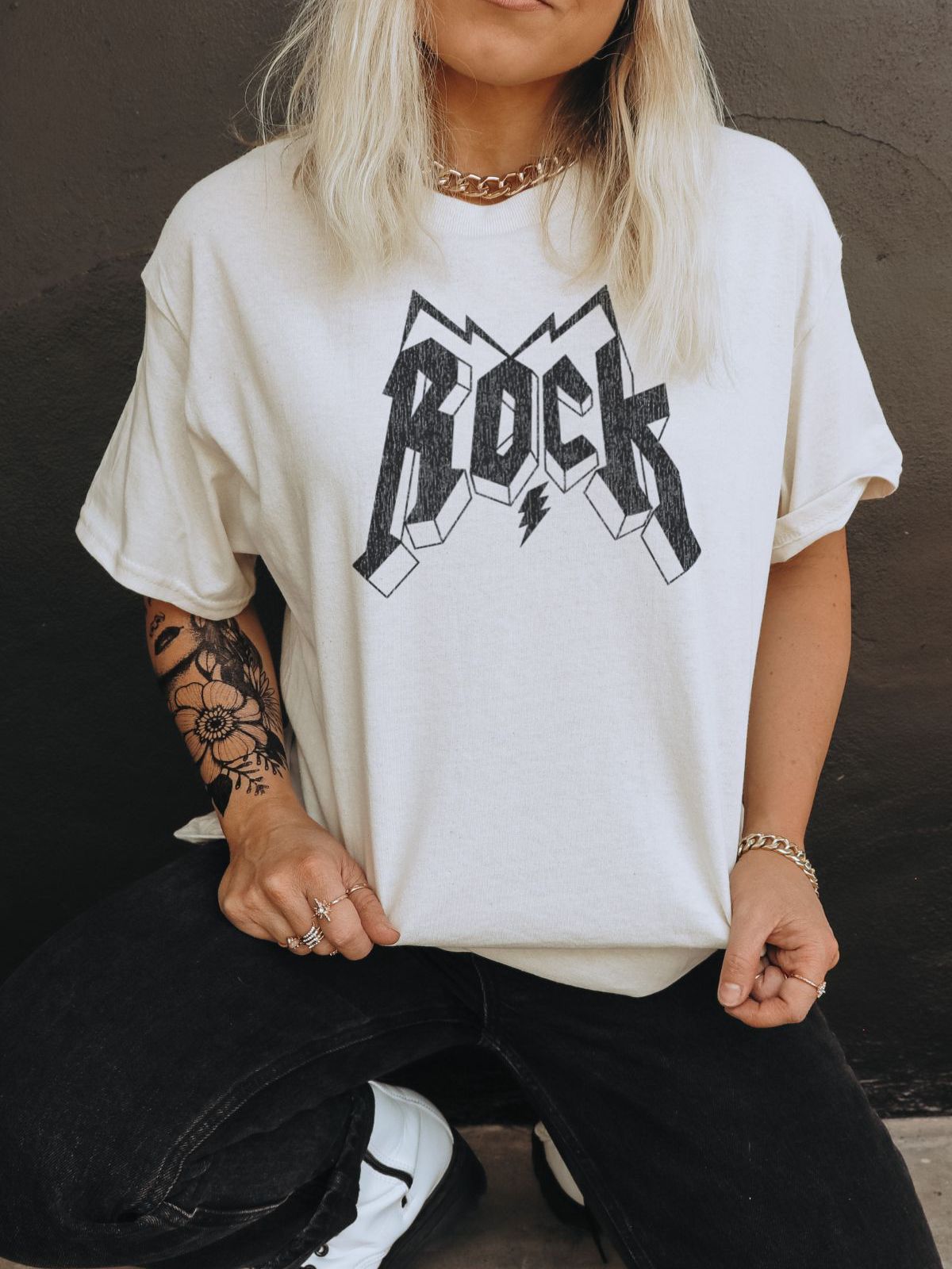 woman wearing a Rock graphic t-shirt
