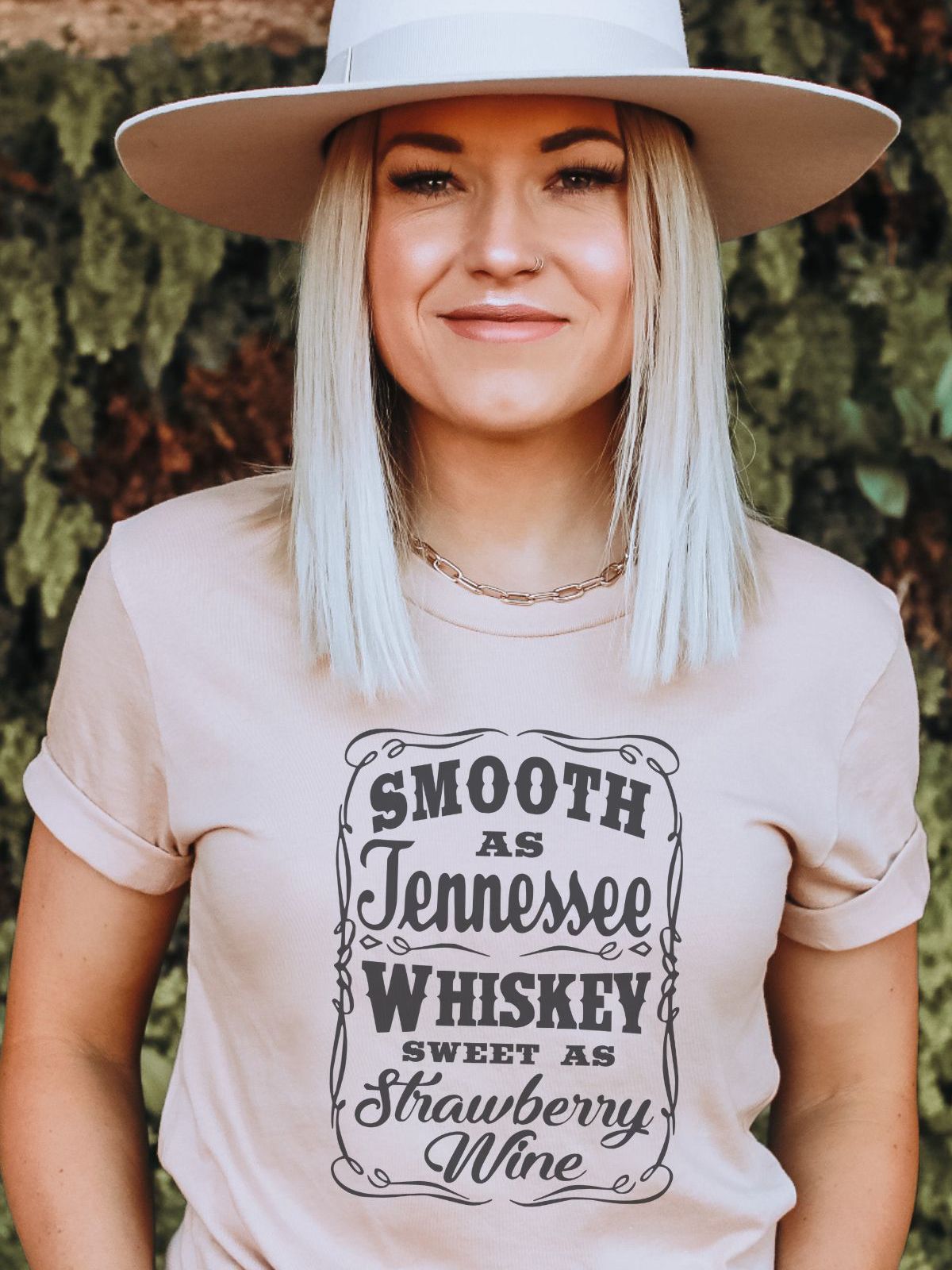 woman wearing a Tennessee whiskey themed t-shirt
