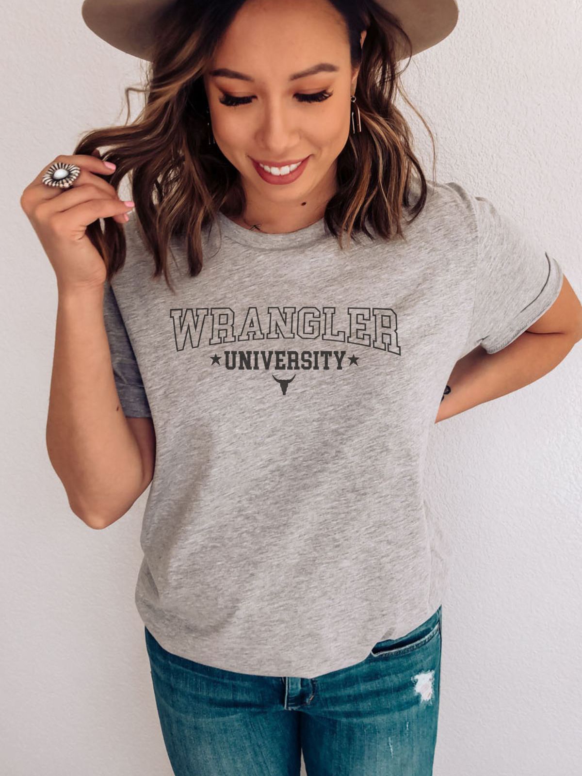 woman wearing grey Wrangler University t-shirt with hat