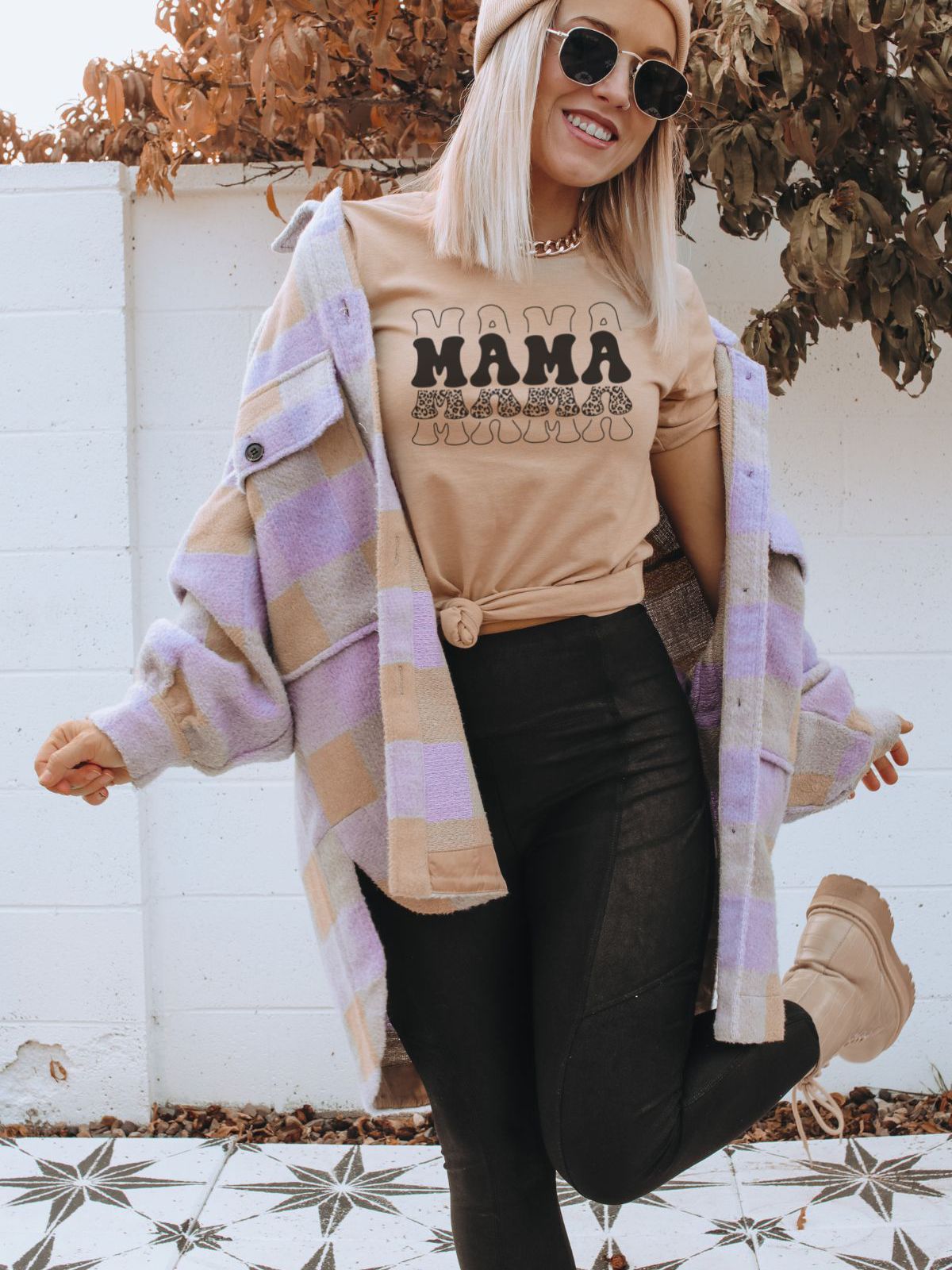 woman wearing mama text t-shirt and plaid coat