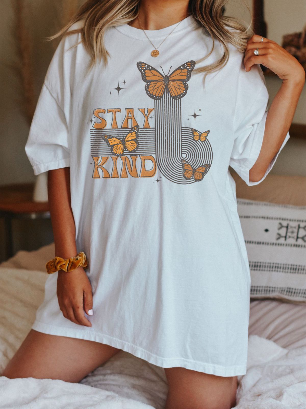 woman wearing Stay Kind butterfly t-shirt