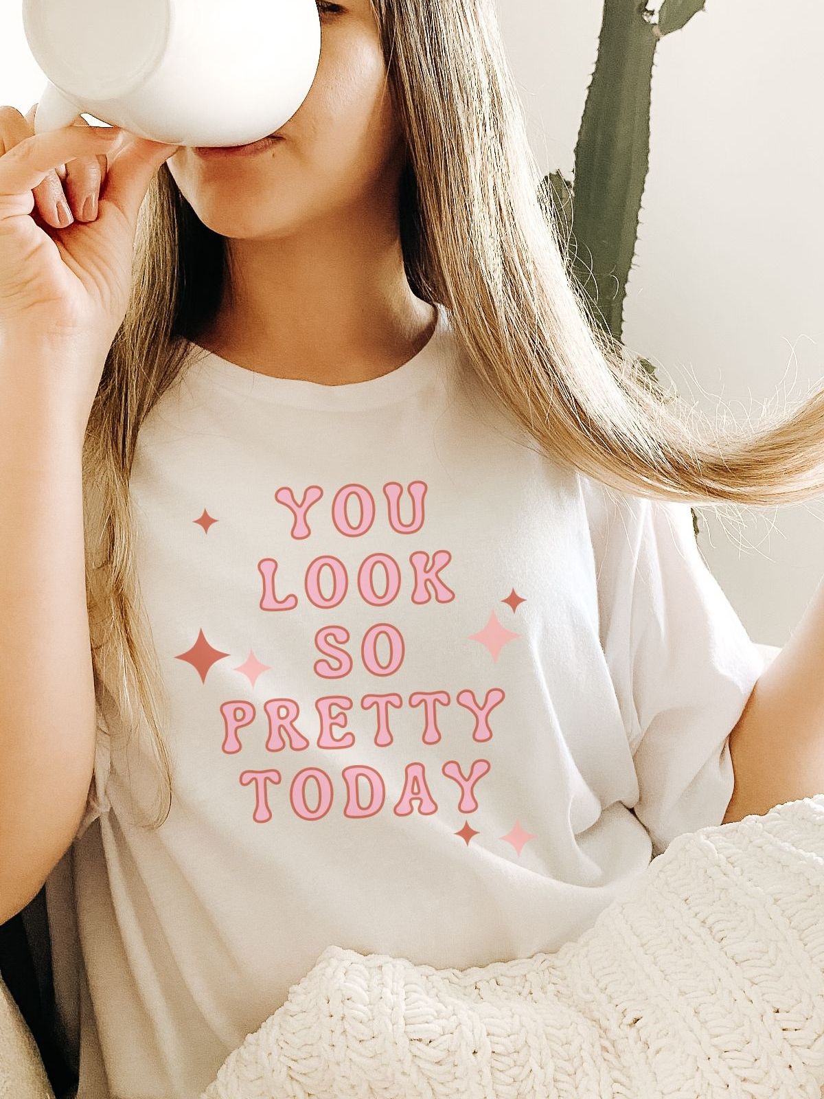 woman wearing a tee with you look so pretty today text
