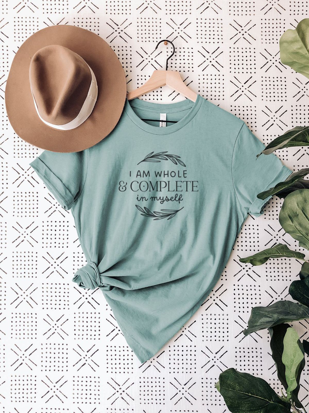 Green T-shirt with text I am whole and complete