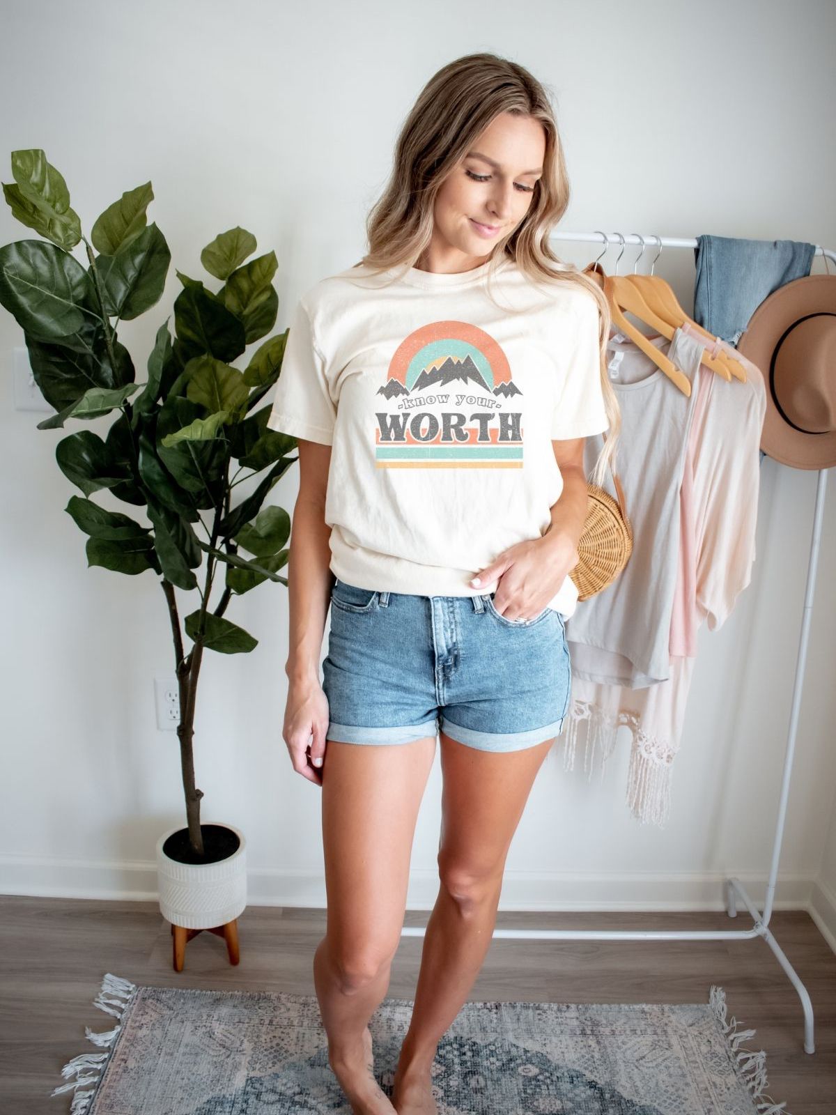 woman wearing know your worth graphic t-shirt