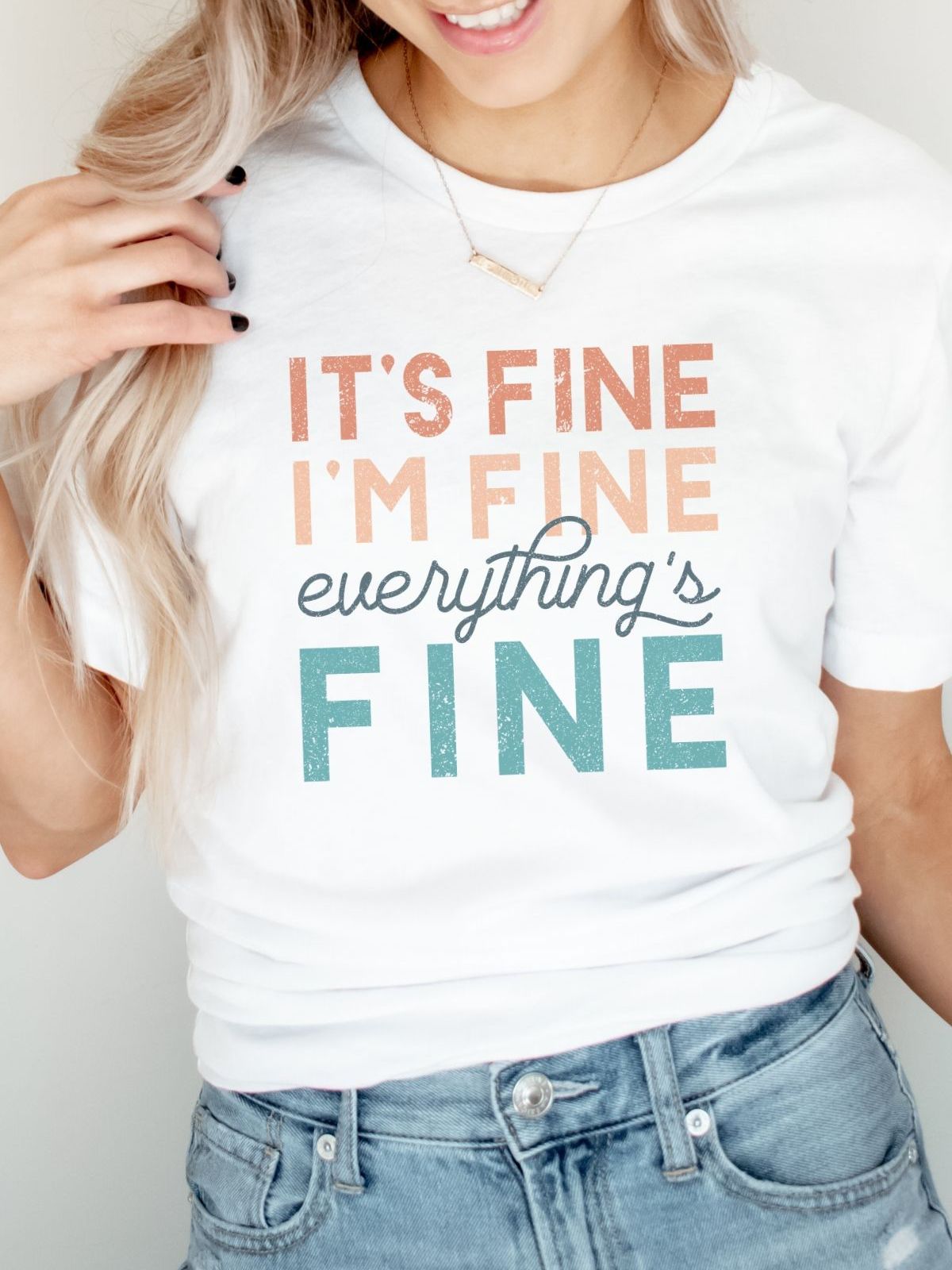White t-shirt with Its Fine Im Fine Everythings Fine text